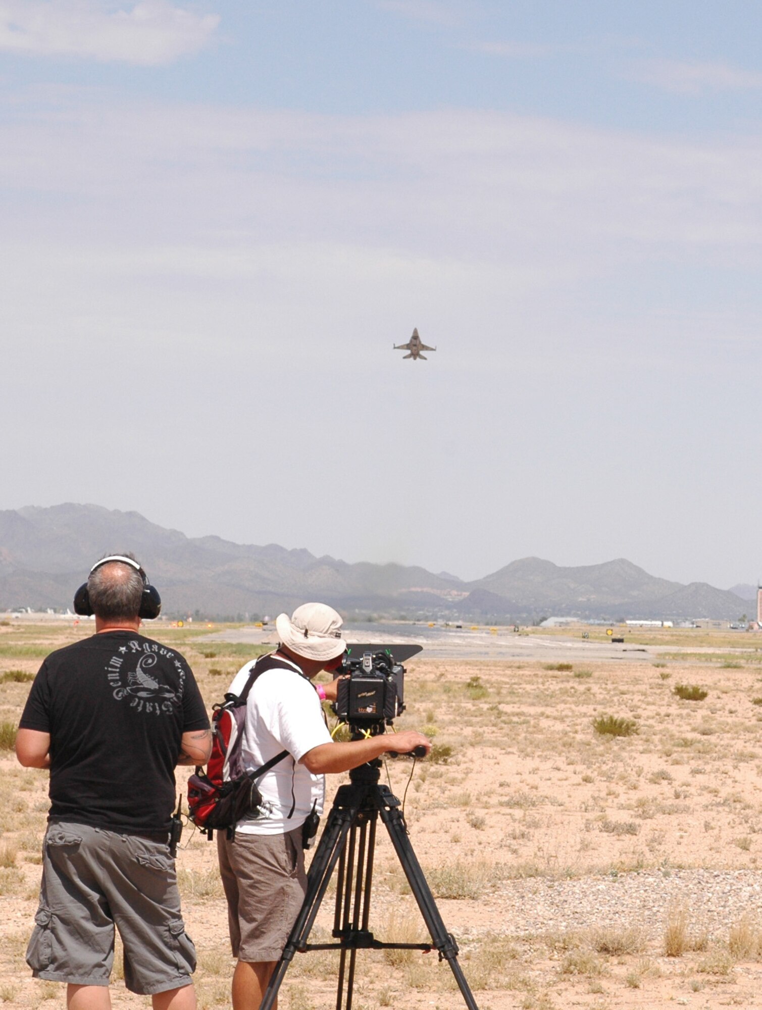A United Arab Emirates F-16E Desert Falcon, block 60, takes off from Tucson International Airport while a documentary film crew captures the moment Aug. 12. Recognizing the historic significance of their first Red Flag, the U.A.E. government commissioned a production company to follow pilots and maintainers through the experience. (Air National Guard photo by Capt. Dan Dodson)