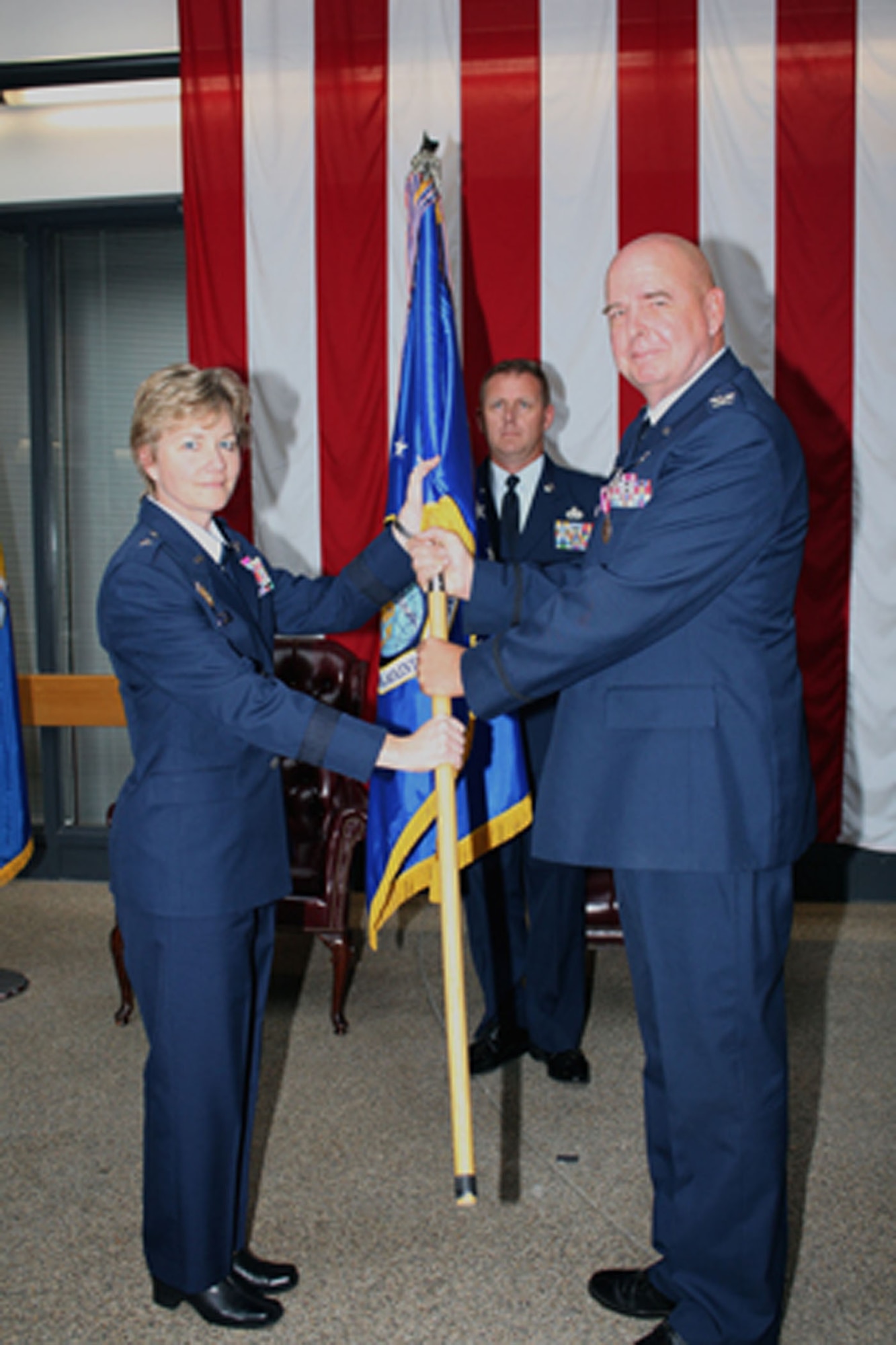 TRAVIS AIR FORCE BASE, Calif. -- Col M. J. Giddings Jr. assumed command of the 349th Maintenance Group here in a ceremony officiated by Brig. Gen. Maryanne Miller, Aug 22. Col. Giddings, from the 482d Fighter Wing at Homestead Air Reserve Base, Fla., relieved outgoing commander Col William B. Anholt (pictured here with Brig. Gen. Miller) who will become the 446th Maintenance Group commander at McChord AFB, Wash. (U.S. Air Force photo/Master Sgt. Robert Wade)