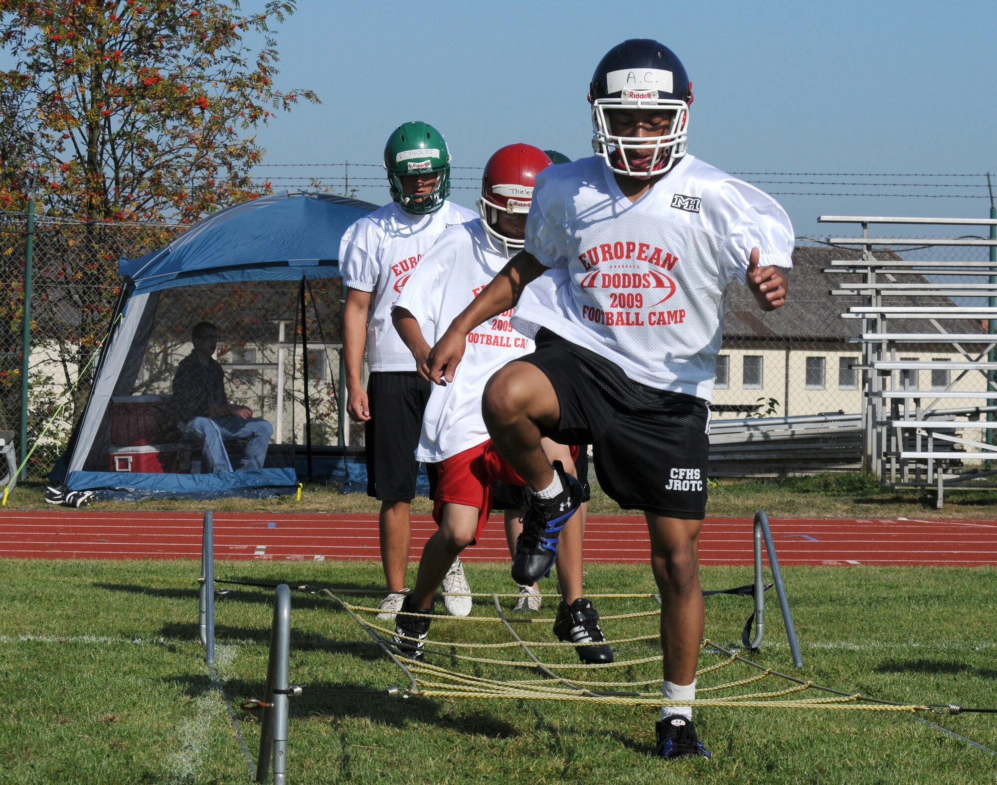 SPANGDAHLEM AIR BASE, Germany – Future football players run through ropes designed to enhance an athlete’s agility during a Department of Defense Dependant Schools-Europe football camp hosted by Bitburg High School Aug. 19. The camp, held Aug. 18-21, brought together football players from across Europe to gain experience for the upcoming season. (U.S. Air Force photo/Airman 1st Class Nathanael Callon)