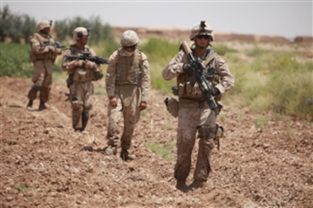 U.S. Marine Corps Staff Sgt. William Eddy leads Marines and sailors during a patrol near Fire Base Fiddler's Green, Helmand province, Afghanistan, on Aug. 3, 2009.  Eddy is attached to Headquarters Battery, 3rd Battalion, 11th Marine Regiment.  His unit is deployed with Regimental Combat Team 3 to conduct counterinsurgency operations in partnership with the Afghan National Security Forces in southern Afghanistan.  