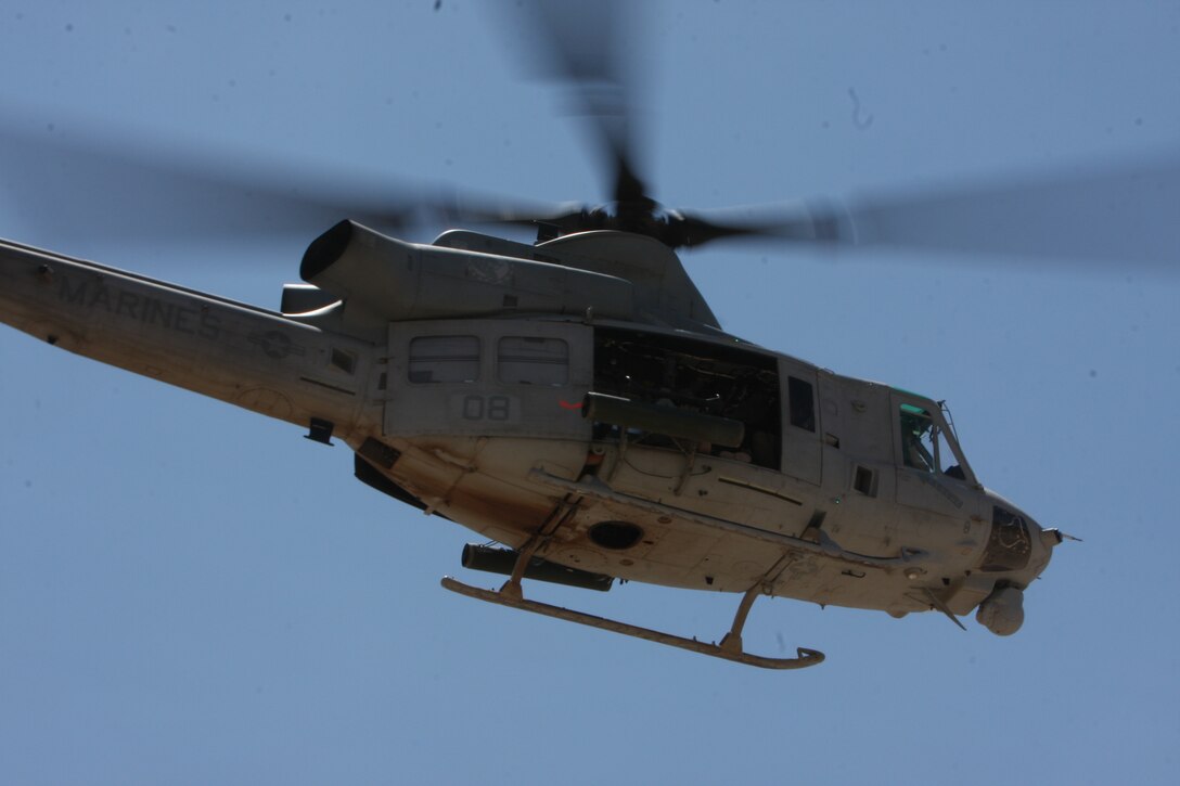 A UH-1 Yankee Super Huey takes off from the Combat Center's Prospect training area Aug. 25 during Enhanced Mojave Viper aviation training conducted by Marine Light Attack Helicopter Squadron 367 and Marine Wing Support Squadron 372 from Marine Corps base Camp Pendleton, Calif. HMLA-367 will be the first unit fully transitioned into flying the new aircraft to deploy to Afghanistan later this year.