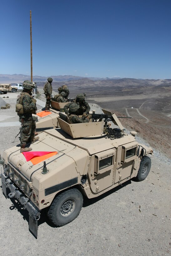 Marines with Weapons Company, 3rd Battalion, 7th Marine Regiment, fire the M-2 .50 caliber heavy machine gun during a live-fire training exercise at the Hawthorne Army Ammunition Depot, Nev., Aug. 25. The unit traveled to Hawthorne from the Marine Corps Mountain Warfare Training Center, Bridgeport, Calif., to conduct operations in conjunction with the mountain warfare training evolution the battalion is currently going through at MWTC.