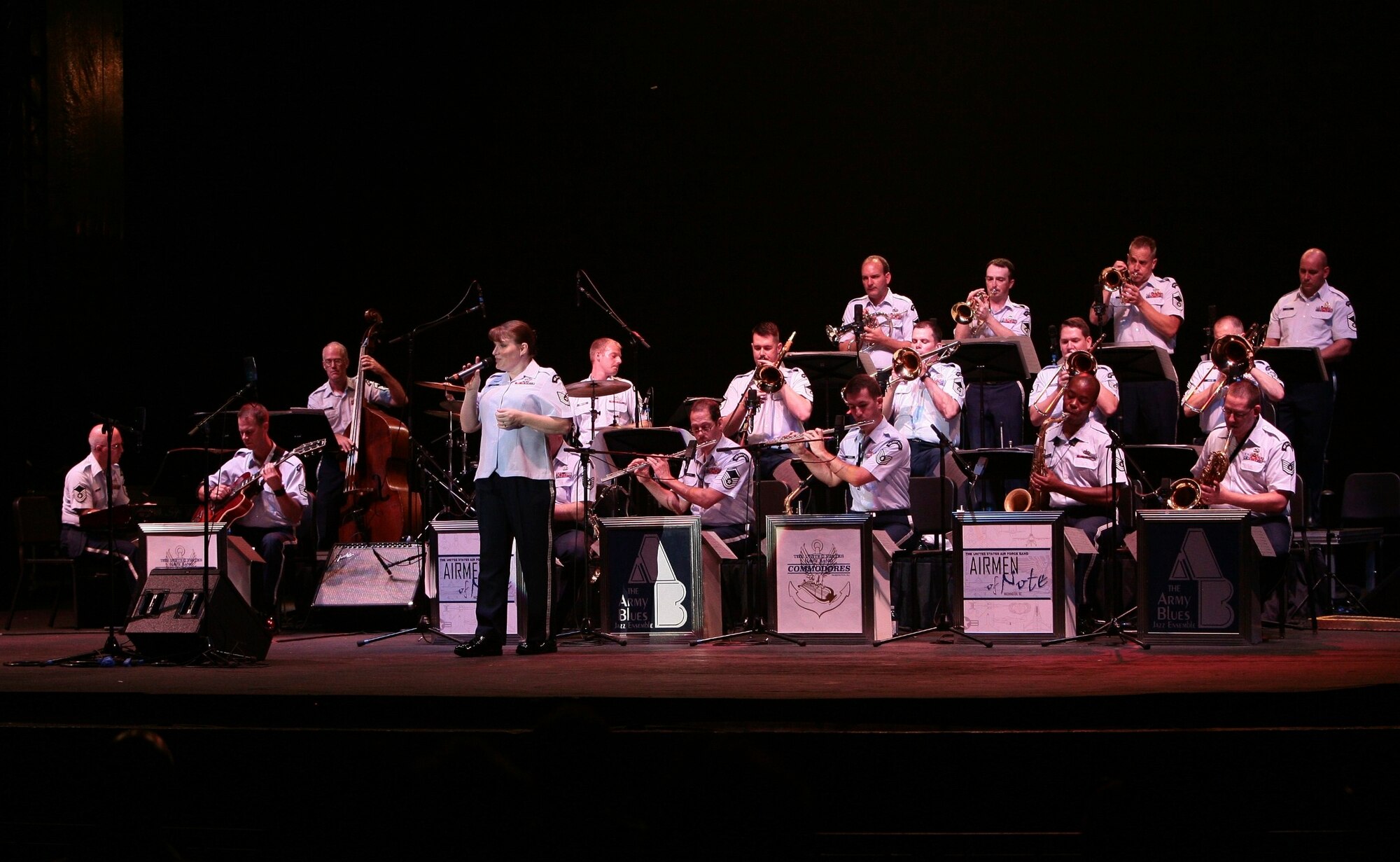 Technical Sgt. Paige Martin, vocalist for The Airmen of Note, leads the ensemble at the 3rd annual Joint Service Jazz Festival in Washington, DC.  The concert, which took place at the Carter Barron Amphitheatre on August 16th, also featured the Army Blues and the Navy Commodores.  (photo by SFC Mark Wood, U.S. Army Band)