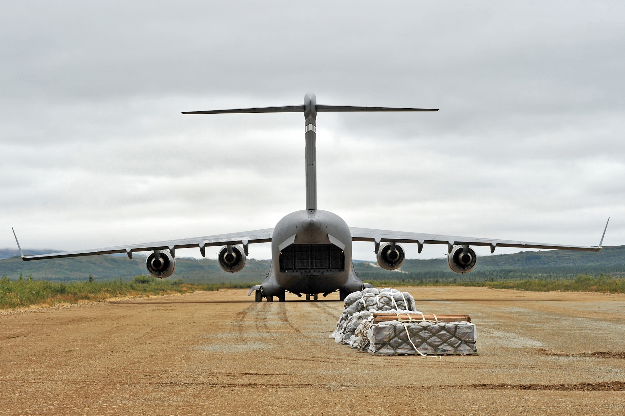 DONNELLY LANDING ZONE, Alaska -- The ramp of a C-17 Globemaster III from the 517th Airlift Squadron closes after dropping five pallets of cargo at the Donnelly dirt air strip Aug. 24, 2009. The aircraft also assisted in deploying 120 Soldiers from the 17th Combat Service Support Battalion on Fort Richardson to Donnelly during Arctic Response. Arctic Response is an Army Emergency Deployment Readiness Exercise. Two C-17s flew to Donnelly and delivered five pallets, two Humvees, a trailer, and a passenger carrier. (U.S. Air Force photo/Senior Airman Laura Turner)