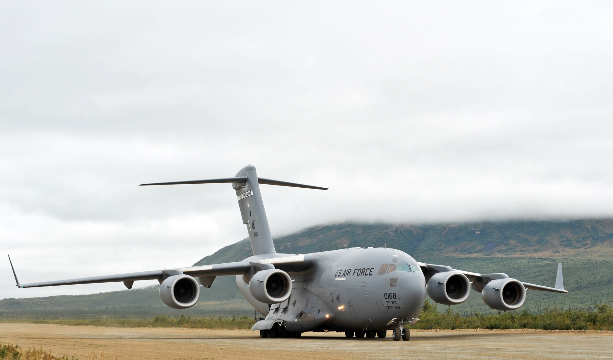 DONNELLY LANDING ZONE, Alaska -- A C-17 Globemaster III from the 517th Airlift Squadron taxi's down Donnelly dirt air strip in preparation to return to Elmendorf Aug. 24, 2009. The aircraft assisted in deploying 120 Soldiers from the 17th Combat Service Support Battalion on Fort Richardson to Donnelly during Arctic Response. Arctic Response is an Army Emergency Deployment Readiness Exercise. Two C-17s flew to Donnelly and delivered five pallets, two Humvees, a trailer, and a passenger carrier. (U.S. Air Force photo/Senior Airman Laura Turner)