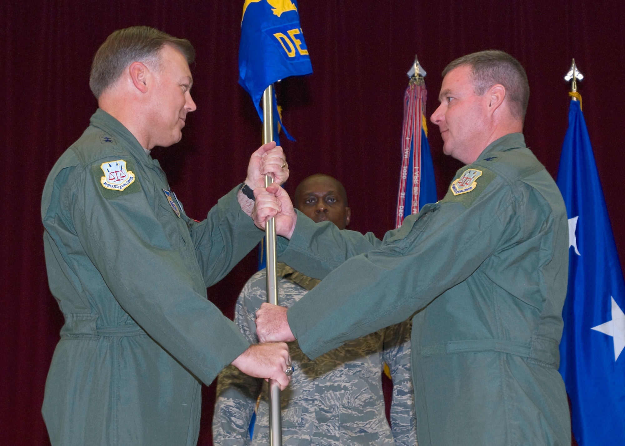 Col. Paul Daly accepts the Air Force Operational Test and Evaluation Detachment 5 guidon from Maj. Gen. Stephen Sargeant, AFOTEC commander during a change of command ceremony here Aug. 21. (Air Force photo/Heather Anhalt)