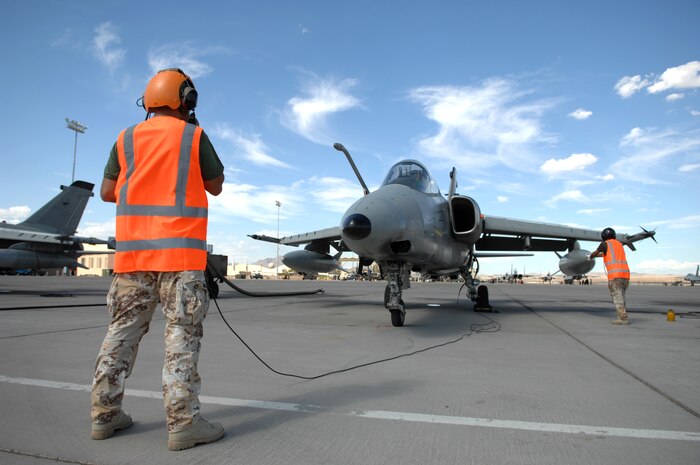 NELLIS AIR FORCE BASE Nev.-- Italian Air Force Crew Chief, Chief Master Sgt. Francesco Alberico and Avionics Technician Chief Master Sgt. Giuseppe Di Pasquale conduct pre-flight checks on an AMX/A-1 before a their first Red Flag 09-5 training mission here Aug 24. Before flying in Red Flag, the Italian Air Force participated in their first ever Green Flag—a realistic close air support training exercise for Airmen and Soldiers preparing to deploy in support of combat operations in Southwest Asia. During the two-week exercise held Aug. 7-21, the Italian Air Force worked closely with U.S. Air Force joint terminal attack controllers embedded with the 3rd Infantry Division at Fort Irwin, Calif., to protect 6,000 Soldiers from an opposing enemy force in a 1,000-square-mile combat environment. Red Flag 09-5 ends Sept., 4. (U.S. Air Force photo by Tech. Sgt. Michael R. Holzworth)(Released)