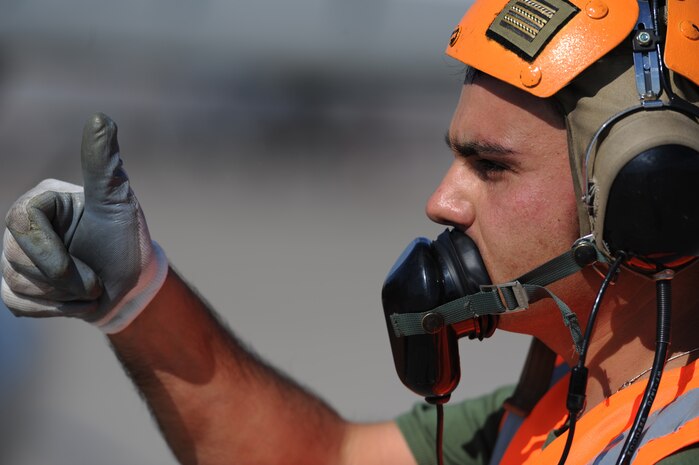 NELLIS AIR FORCE BASE Nev.-- Italian Air Force Crew Chief, Chief Master Sgt. Francesco Alberico gives a thumbs up to a pilot of an AMX/A-1 before a training mission at Red Flag 09-5 Aug. 24. Before flying in Red Flag, the Italian Air Force participated in their first ever Green Flag—a realistic close air support training exercise for Airmen and Soldiers preparing to deploy in support of combat operations in Southwest Asia. During the two-week exercise held Aug. 7-21, the Italian Air Force worked closely with U.S. Air Force joint terminal attack controllers embedded with the 3rd Infantry Division at Fort Irwin, Calif., to protect 6,000 Soldiers from an opposing enemy force in a 1,000-square-mile combat environment. Red Flag 09-5 ends Sept., 4. (U.S. Air Force photo by Tech. Sgt. Michael R. Holzworth)(Released)