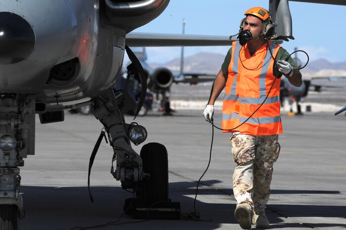 NELLIS AIR FORCE BASE Nev.-- Italian Air Force Crew Chief, Chief Master Sgt. Francesco Alberico conducts pre-flight checks on an AMX/A-1 before leaving for a training mission at Red Flag 09-5 Aug. 24. Before flying in Red Flag, the Italian Air Force participated in their first ever Green Flag—a realistic close air support training exercise for Airmen and Soldiers preparing to deploy in support of combat operations in Southwest Asia. During the two-week exercise held Aug. 7-21, the Italian Air Force worked closely with U.S. Air Force joint terminal attack controllers embedded with the 3rd Infantry Division at Fort Irwin, Calif., to protect 6,000 Soldiers from an opposing enemy force in a 1,000-square-mile combat environment. Red Flag 09-5 ends Sept., 4. (U.S. Air Force photo by Tech. Sgt. Michael R. Holzworth)(Released) 