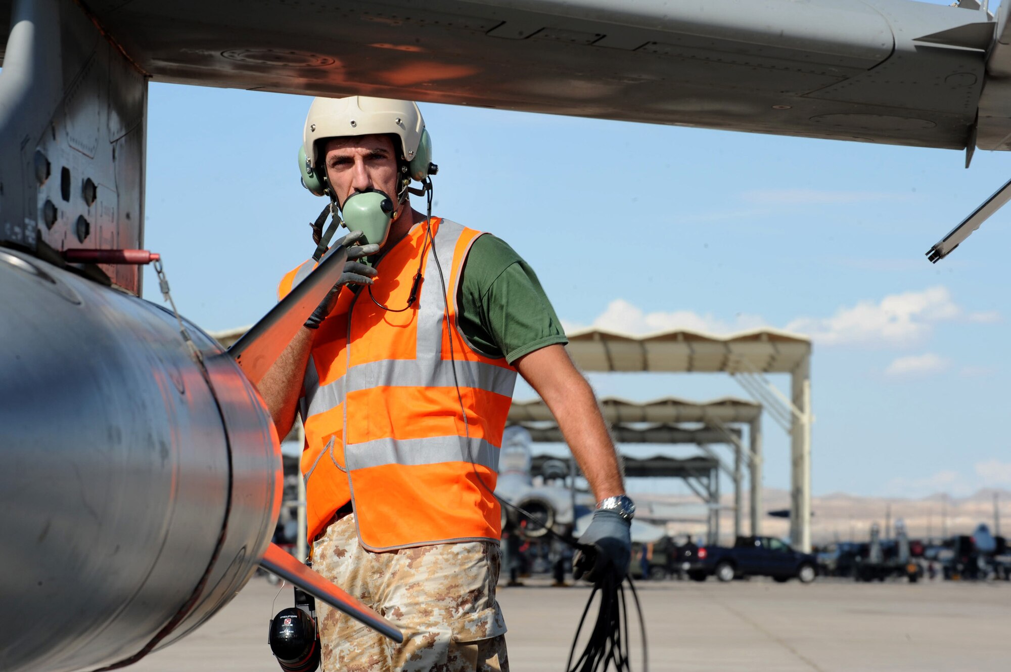 NELLIS AIR FORCE BASE Nev.-- Italian Air Force Crew Chief, Master Sgt. Alex Biancardi prepares to launch an AMX/ A-1 fighter for a training mission at Red Flag 09-5 Aug. 24. Before flying in Red Flag, the Italian Air Force participated in their first ever Green Flag—a realistic close air support training exercise for Airmen and Soldiers preparing to deploy in support of combat operations in Southwest Asia. During the two-week exercise held Aug. 7-21, the Italian Air Force worked closely with U.S. Air Force joint terminal attack controllers embedded with the 3rd Infantry Division at Fort Irwin, Calif., to protect 6,000 Soldiers from an opposing enemy force in a 1,000-square-mile combat environment. Red Flag 09-5 ends Sept., 4. (U.S. Air Force Photo by Airman 1st Class Jamie Nicley) (Released)