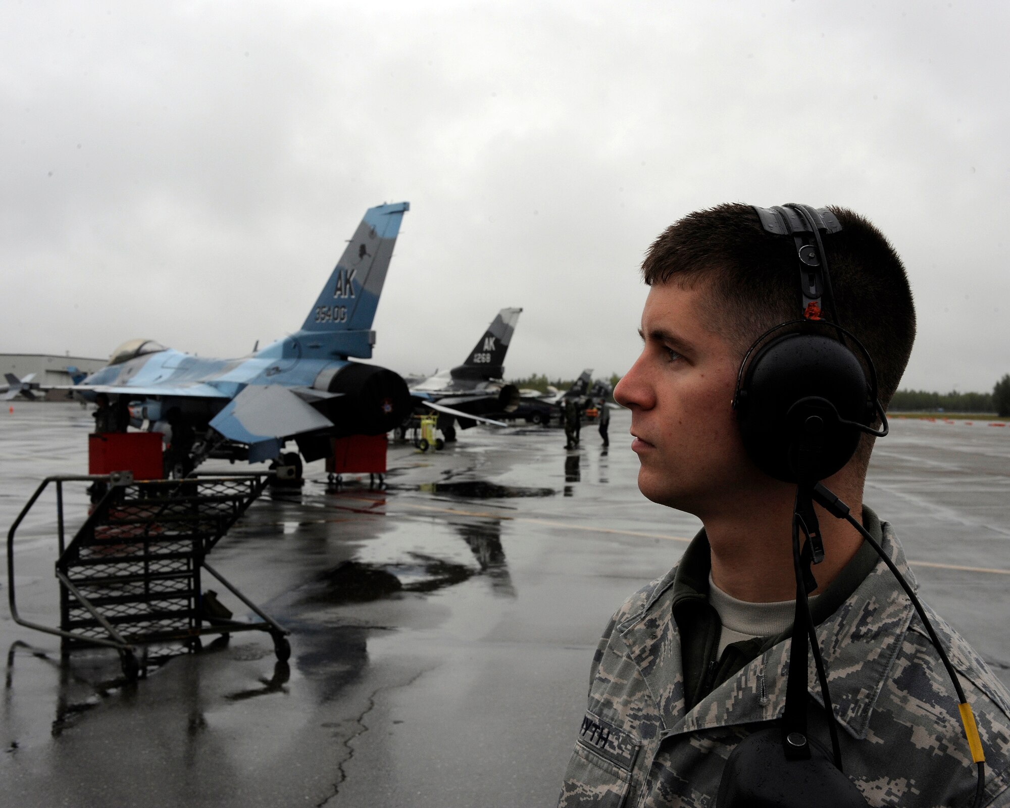 Staff Sgt. David Smyth watches an F-16 Fighting Falcon prepare for takeoff Aug. 19, 2009, Eielson Air Force Base, Alaska. Sergeant Smyth is an avionics technician assigned to the 354th Maintenance Squadron. (U.S. Air Force photo/Airman 1st Class Willard E. Grande II)
