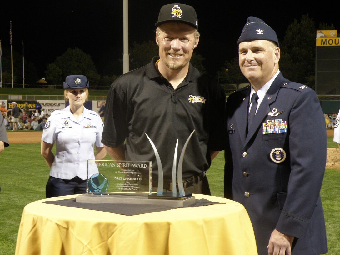 Col. Mark Ward, 372nd Recruiting Group commander, presents the American Spirit Award to Greg Miller Aug. 22 at the Salt Lake Bees baseball game at Spring Mobile Park in Salt Lake City, Utah, Aug. The Bees were awarded the Air Force Recruiting Service's top civic award for their unwavering support of the Air Force. Mr. Miller is chief executive officer for Larry H. Miller Group of Companies that owns the Salt Lake Bees. (U.S. Air Force photo/Christa D'Andrea)   