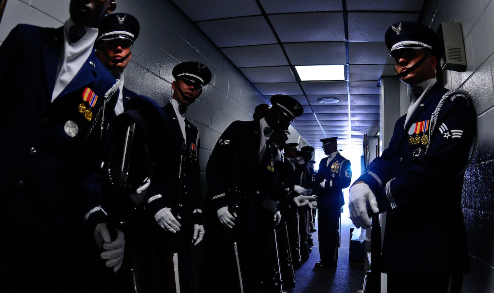 United States Air Force Honor Guard Drill Team members wait to be announced before a performance Aug. 20 at Tyndall Air Force Base, Fla. The team performs on military installations and in local communities during their Florida tour, showcasing Air Force professionalism and teamwork. (U.S Air Force photo by Senior Airman Alexandre Montes)