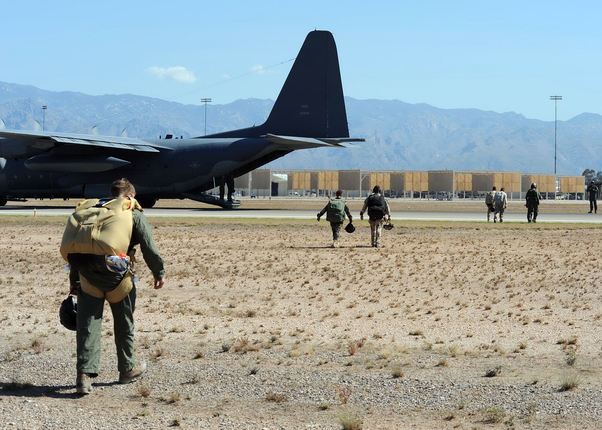 Airmen from to 306th Rescue Squadron prepare to load a HC-130 to get ready
for their next drop at Davis-Monthan Air Force Base, Ariz., Aug. 15, 2009.
The Airmen were participating with  the 79th Rescue Squadron in the first
multi-lift HC-130 airdrop here. Usually the members have to use another
facility to conduct the drops. They were able to accomplish seven drops from
different altitudes. ( U.S. Air Force Photo by:  Senior Airman Jacqueline
Romero)
