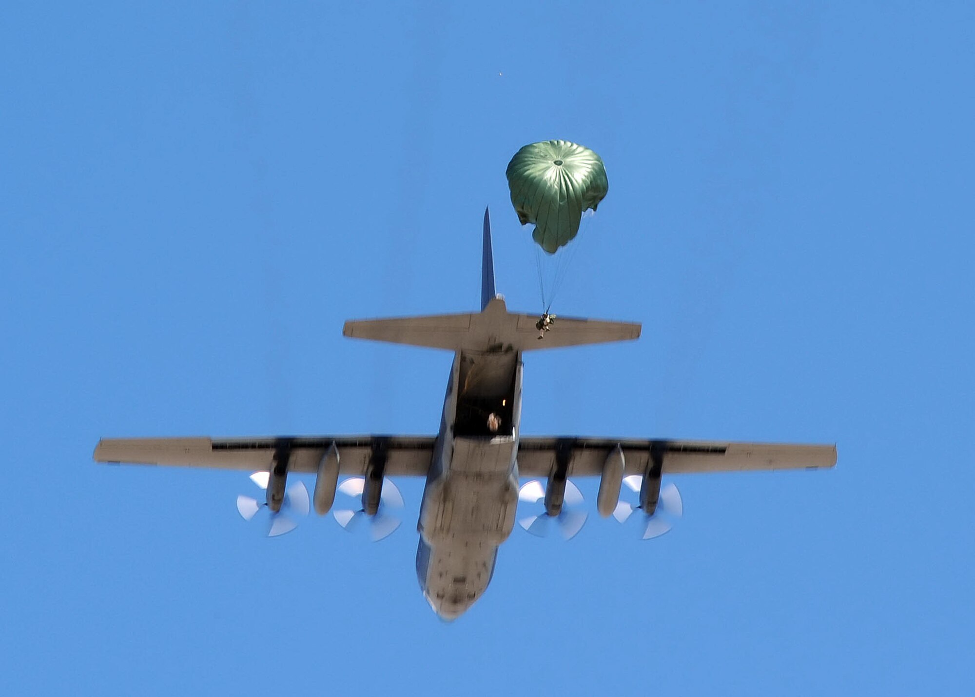 Airmen from the 306th Rescue Squadron, parachute out of a HC-130 at
Davis-Monthan Air Force Base, Ariz., Aug. 15, 2009.  The Airmen were
participating with members of the 79th Rescue Squadron in the first
multi-lift HC-130 airdrop here. Usually the members have to use another
facility to conduct the drops. They were able to accomplish seven drops from
different altitudes. ( U.S. Air Force Photo by:  Senior Airman Jacqueline
Romero)
