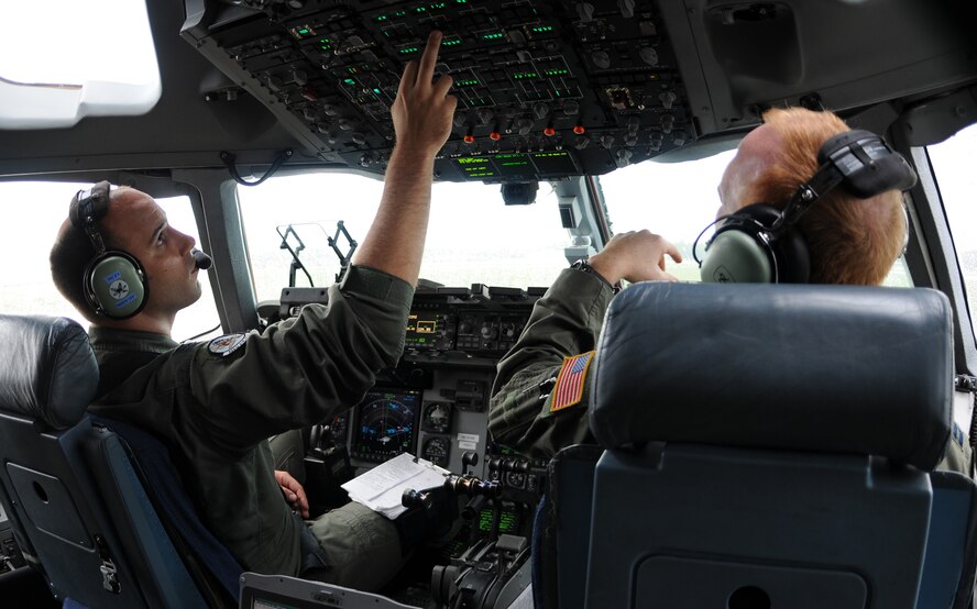 326th Airlift Squadron Pilots Capt. Steve Churchill and Capt. Dan Zappe conduct a training mission consisting of low-level navigation, assault landing zone operations, tactical arrivals and departures in Canadian military airspace Aug. 23. The training was part of the mission to 8 Wing Canadian Forces Base Trenton. In addition to the flight training, the first 512th Airlift Wing visit Aug. 22-24 to the Canadian wing was to forge a partnership and identify future training opportunities for flying, aerial port, airlift control and maintenance operations.(U.S. Air Force photo/Capt. Marnee A.C. Losurdo)