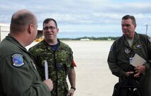Master Sgt. Henry Fortney, 512th Airlift Control Flight loadmaster, left, and Senior Master Sgt. Scott Wilson, 512th ALCF superintendent, met with Canadian Air Force Maj. Aaron Spott, 2 Air Movements Squadron commanding officer Aug. 24 at 8 Wing Canadian Forces Base Trenton, 2 miles northeast of Trenton, Ontario. The purpose of the first 512th Airlift Wing visit Aug. 22 -24 was to forge a partnership with the Canadian wing to identify future training opportunities for flying, aerial port, airlift control and maintenance operations. (U.S. Air Force photo/Capt. Marnee A.C. Losurdo)