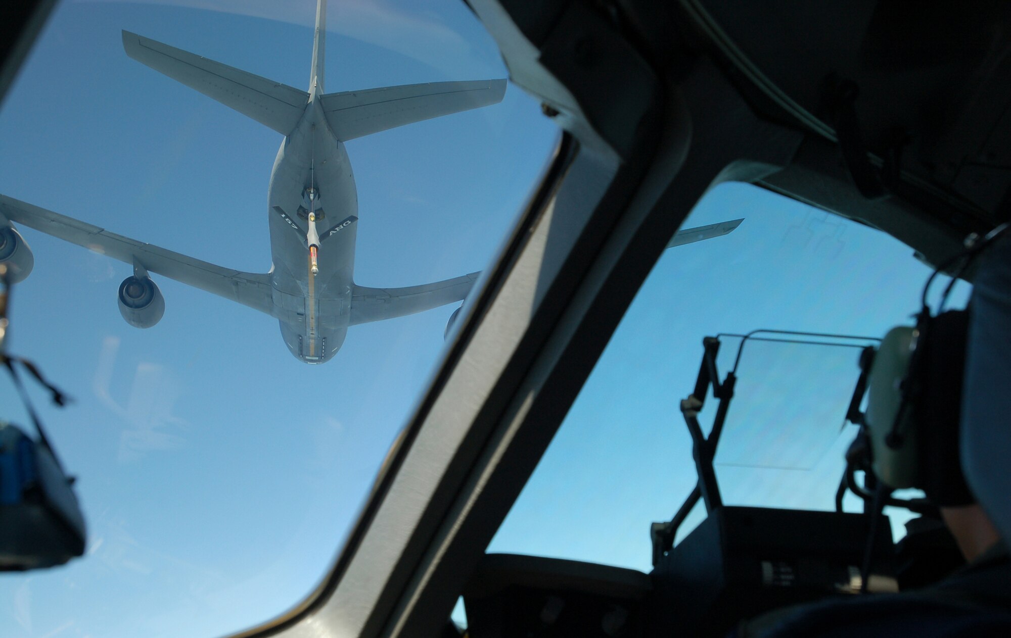 A KC-10 Extender holds the boom steady as the C-17 Globemaster III closes the space between them to make contact and begin refueling. Honorary commanders and military spouses experience the capabilities of the C-17 during a refueling mission July 28. (U.S. Air Force photo/2nd Lt. Abigail Wise)