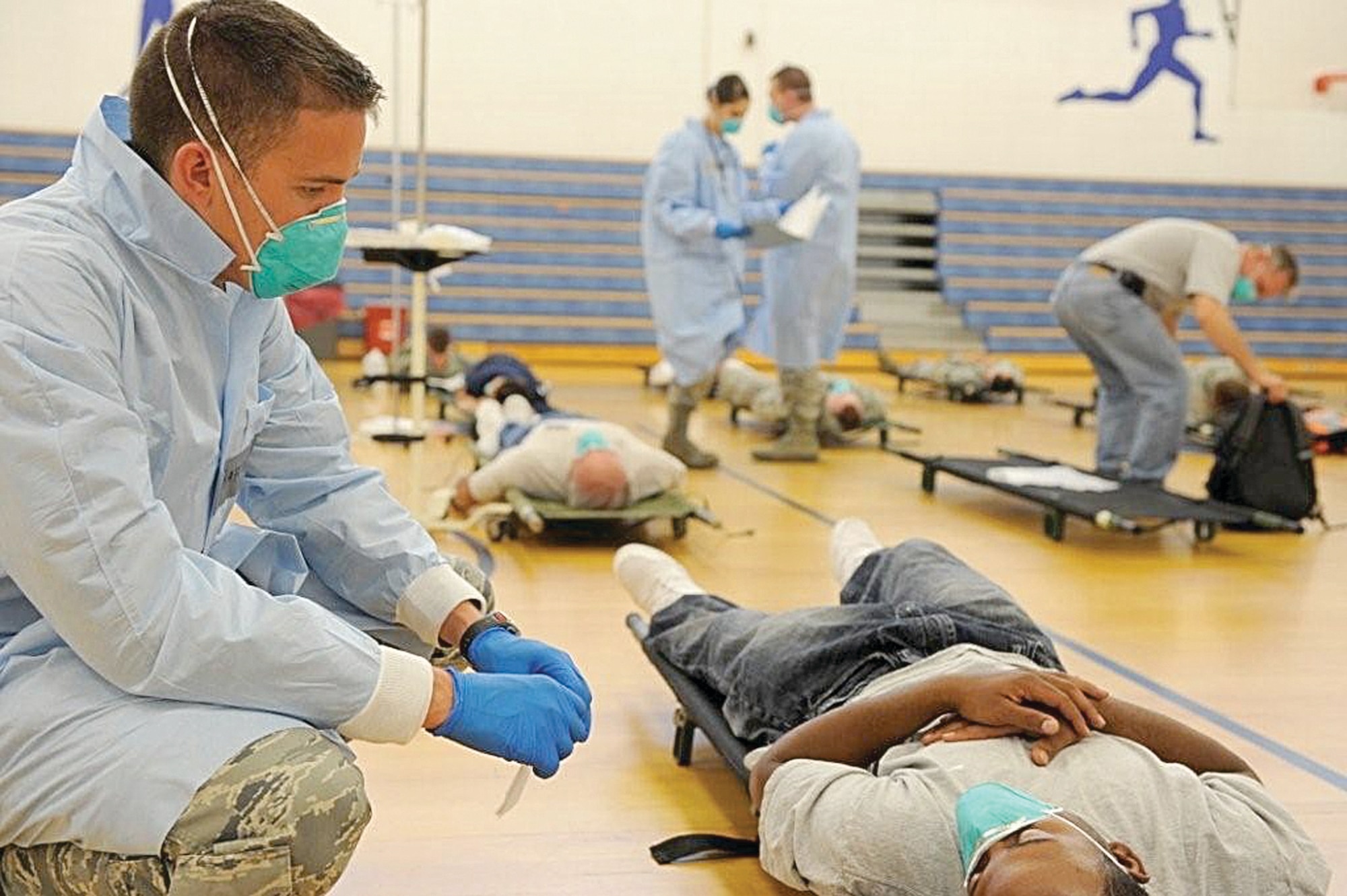 Chaplain Candidate Ryan Williams participates in a disease containment exercise Aug. 13 as participants simulate the effects of a fictitious variant of the H1N1 virus. USAF photo by James Arrowood