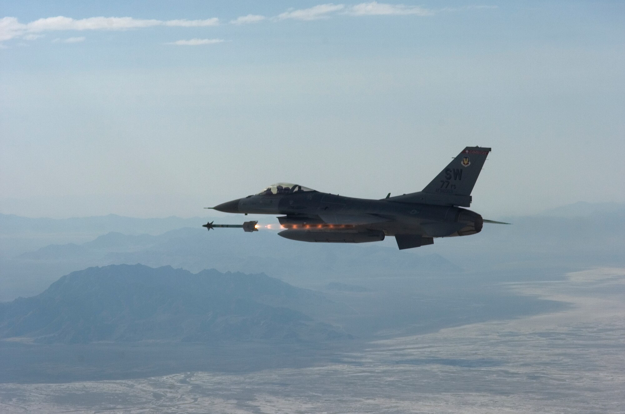 An F-16 Fighting Falcon from the 77th Fighter Squadron at Shaw Air Force Base, S.C., fires an AIM-9 at an aerial target during Combined Weapons System Evaluation Program, a large-scale evaluation at Hill Air Force Base, Utah. The two-week exercise assesses operational effectiveness and suitability of weapons and weapons systems for both air to air and air to ground. (U.S. Air Force photo/Tech. Sgt. Jason Wilkerson)