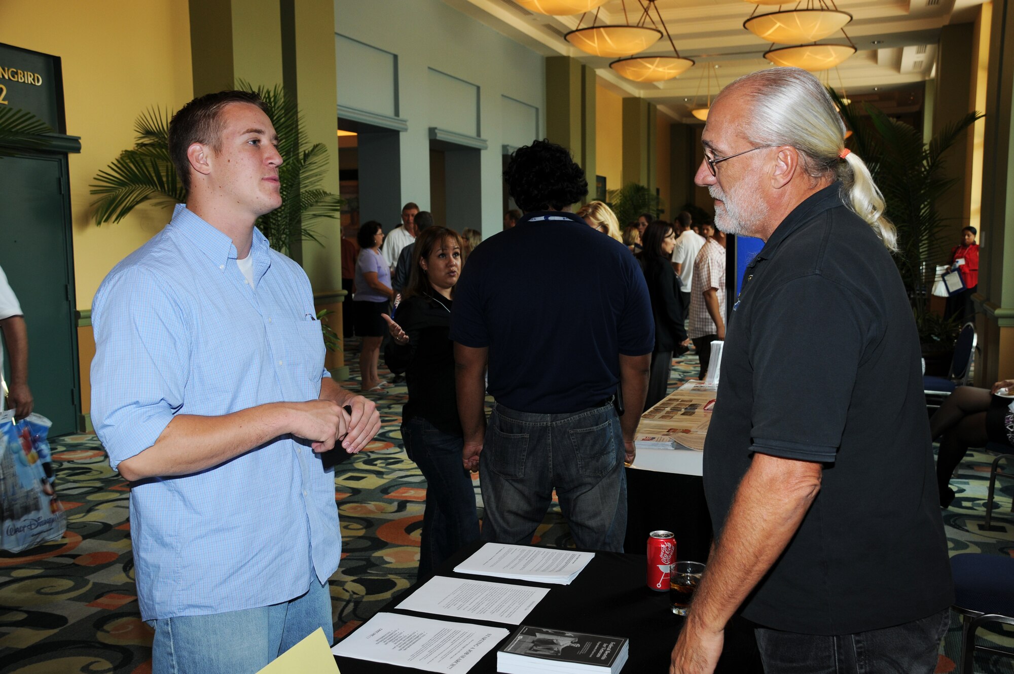 TSgt Max Langford, Boom Operator for the 927th Operation Group, speaks to an Employer Support of the Guard and Reserve (ESGR) Representative about his upcoming deployment at the Yellow Ribbon Conference.(USAF Photo/TSgt Denise Hauser)