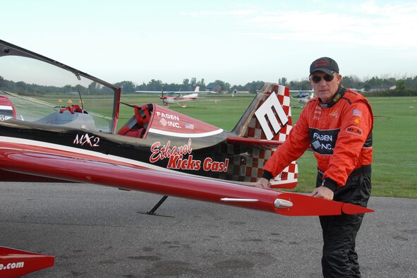 Greg Poe poses with his MX-2 acrobatic plane, sponsored by Fagen, a Minnesota-based company that builds ethanol plants and wind turbines. Poe flew his aircraft at the Selfridge Air Show, drawing a fair amount of media attention from Detroit-area news outlets that normally report on fuel standards for passenger vehicles, rather than stunt planes.  USAF photo by MSgt. Clancey Pence.