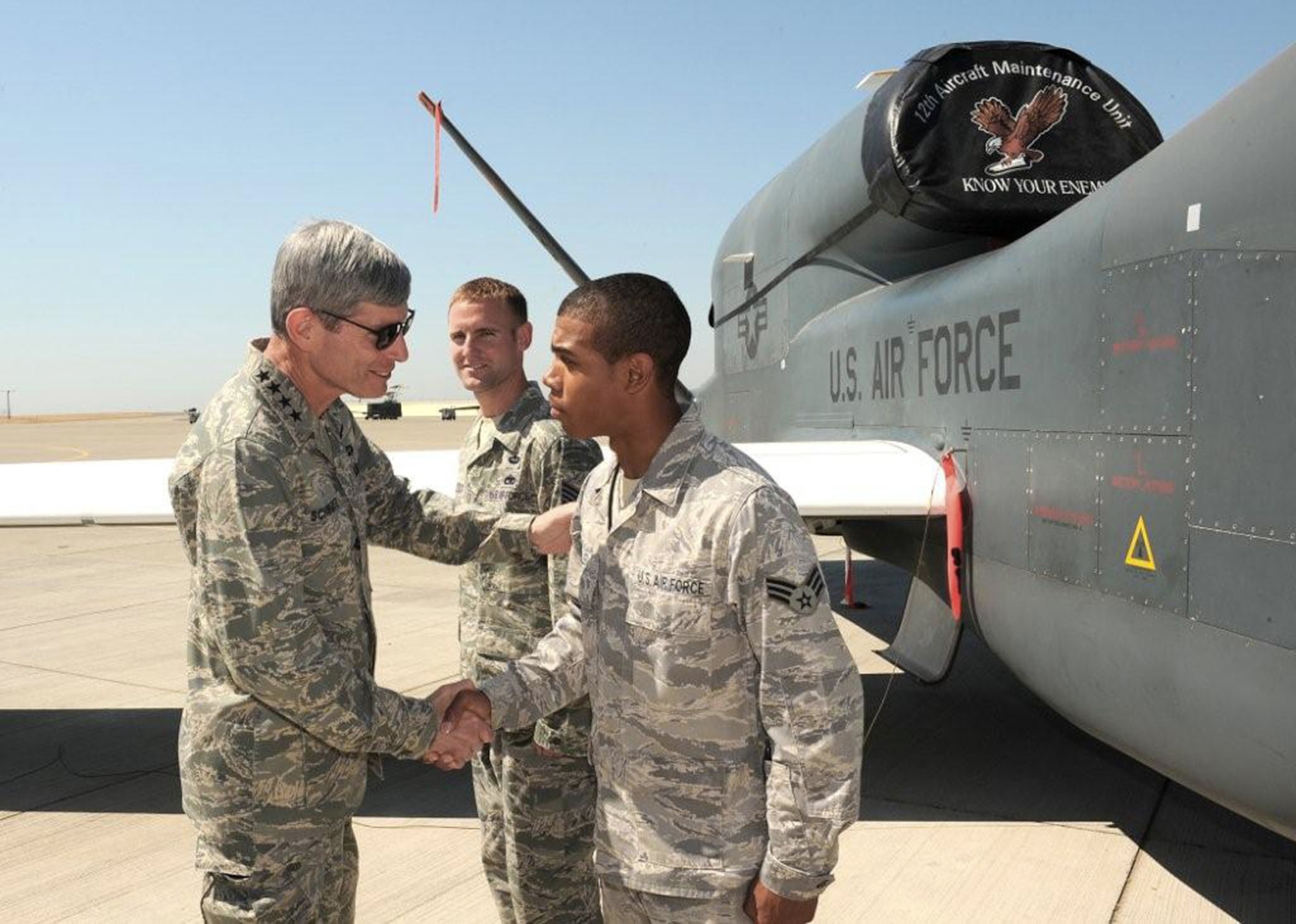 Air Force Chief of Staff Gen. Norton Schwartz greets Senior Airman Keon Miller and Staff Sgt. Jonathan Leloux (rear) Aug. 21 during his visit to Beale Air Force Base, Calif. Airman Miller is an RQ-4 Global Hawk crew chief.  Sergeant Leloux is a Global Hawk avionics system technician. (U.S. Air Force photo/John Schwab)