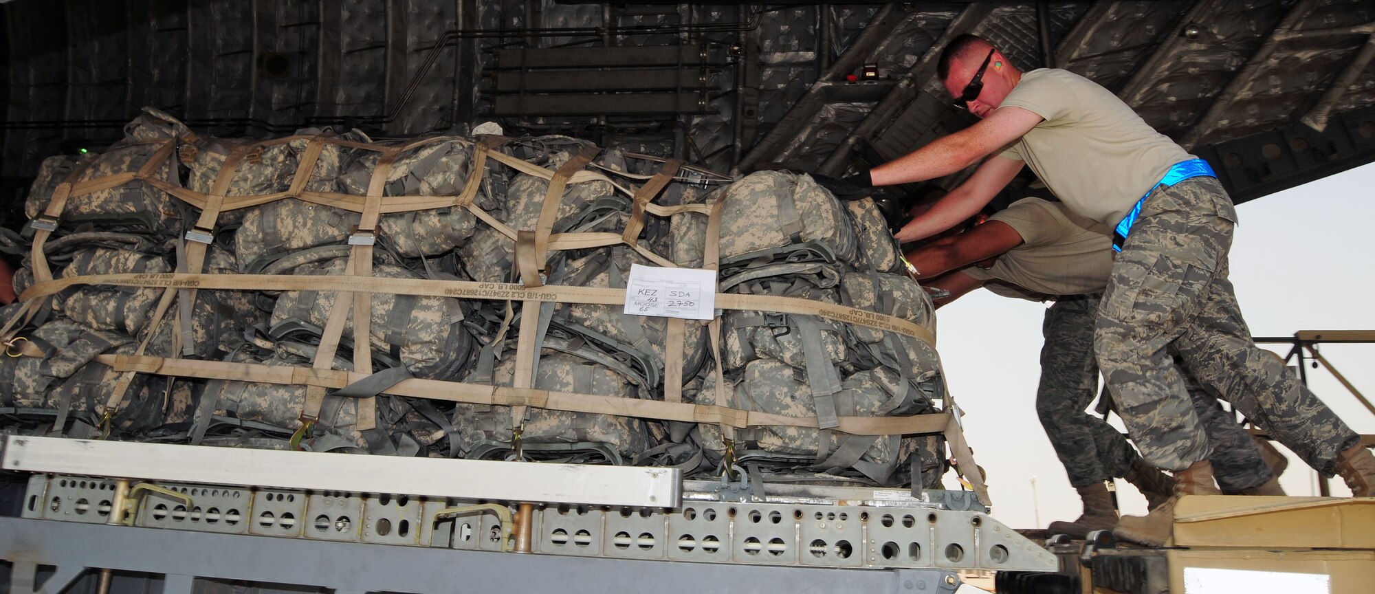 SOUTHWEST ASIA --Tech Sgt. Michael Peppers, 386th Expeditionary Logistics Readiness Squadron Air Terminal Operation Center member, moves a cargo pallet into position aboard a C-17 Globemaster III on the 386th Air Expeditionary Wing parking ramp at an undisclosed location in Southwest Asia Aug. 21, 2009.  Sergeant Peppers is deployed from the 914th Airlift Wing, Niagara Falls Air Reserve Station, N.Y.  (U.S. Air Force photo / Tech Sgt. Tony Tolley)