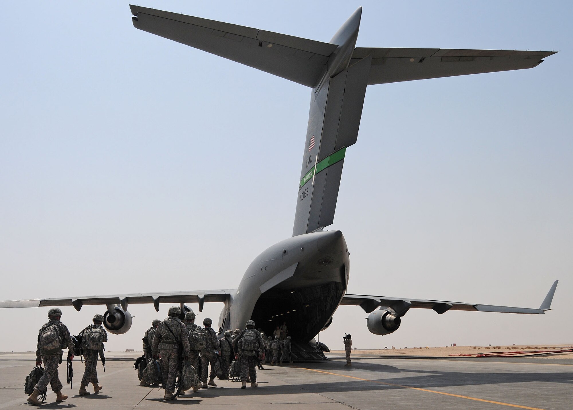 SOUTHWEST ASIA -- U.S. Army personnel from the 3rd Army/Army Central Command prepare to board a 816th Expeditionary Airlift Squadron C-17 Globemaster III on the 386th Air Expeditionary Wing parking ramp at an undisclosed location in Southwest Asia Aug. 21, 2009.  The C-17 is deployed from McChord Air Force Base, Wash.  (U.S. Air Force photo / Tech Sgt. Tony Tolley)