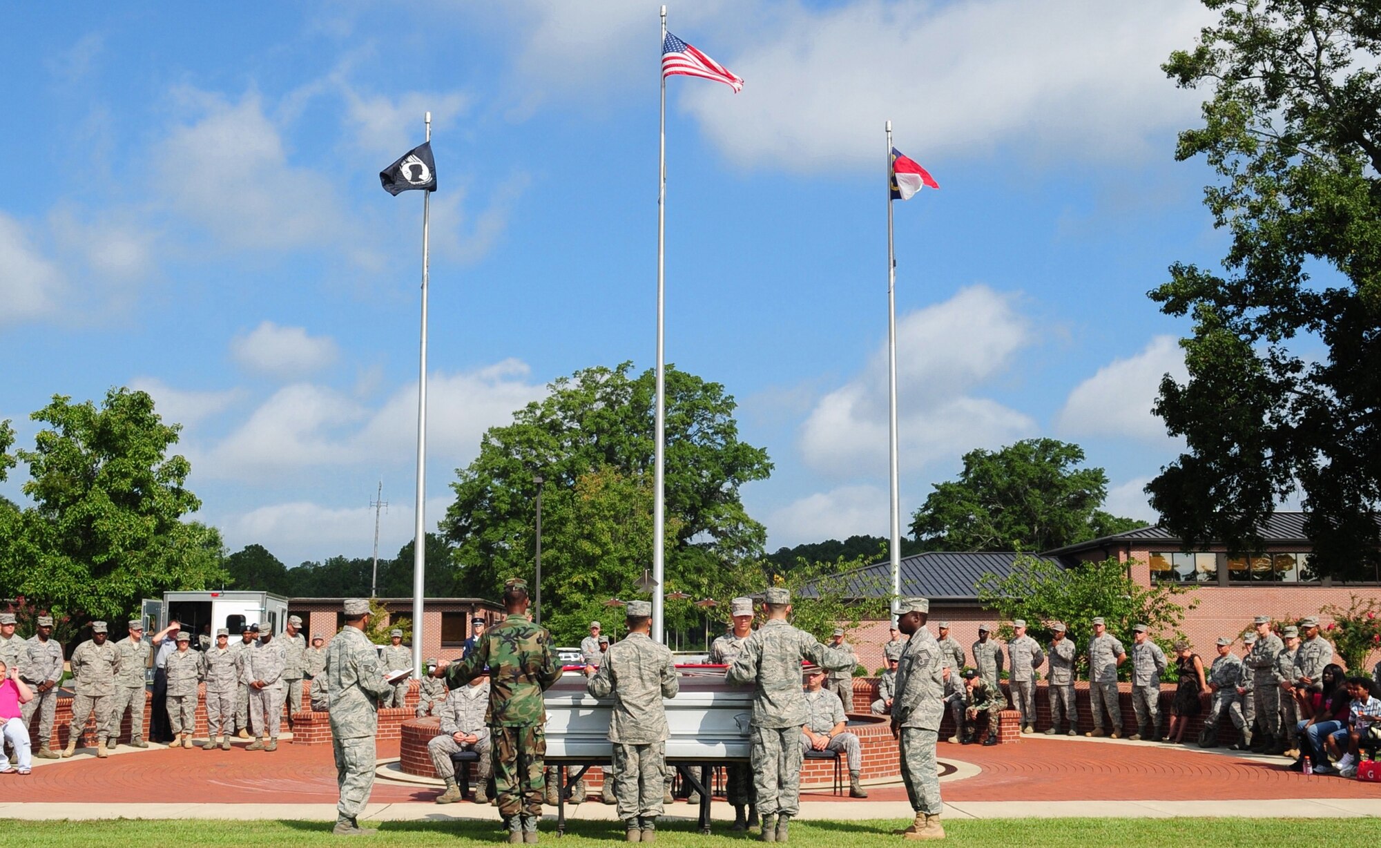 Honor guard Airmen from the 4th Fighter Wing and Charlotte Air National Guard conduct a mock military funeral during a graduation ceremony at Seymour Johnson Air Force Base, N.C., Aug. 19, 2009. Members of the Air Force honor guard trained students on the performance of military funerals. The students also reviewed firing party, pallbearing and presentation of colors training techniques.  (U.S. Air Force photo by Airman 1st Class Rae Perry)