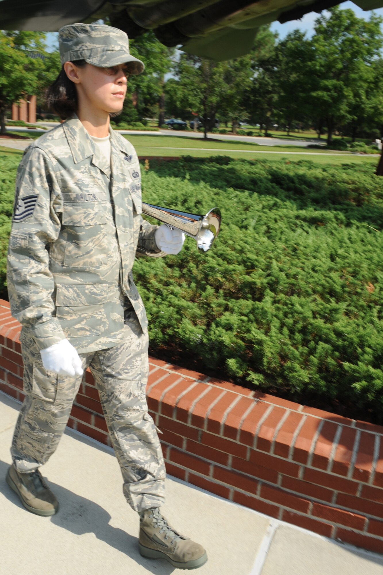 Tech. Sgt Landaii Hilton, Charlotte Air National Guard, marches to her position to play taps during the honor guard graduation ceremony at Seymour Johnson Air Force Base, N.C., Aug. 19, 2009. Twenty-nine members of Team Seymour and the Charlotte Air National Guard graduated after 10 days of training conducted by Airmen from the Air Force Honor Guard. (U.S. Air Force photo by Airman 1st Class Whitney Lambert)