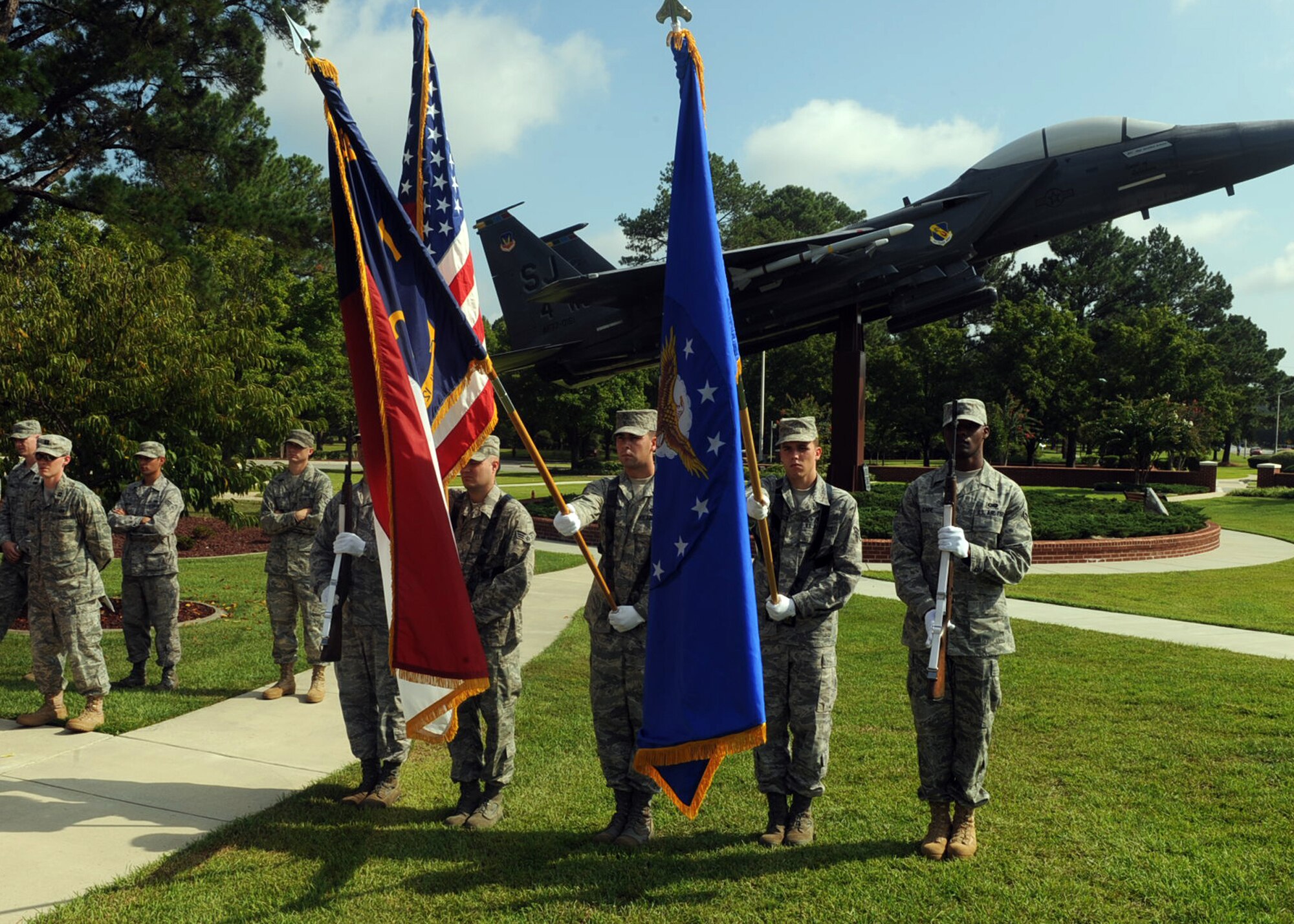 Honor guard members from the 4th Fighter Wing and Charlotte Air National Guard present arms during an honor guard graduation ceremony at Seymour Johnson Air Force Base, N.C., Aug. 19, 2009. The ceremony included a simulated military funeral performance and a presentation of arms. (U.S. Air Force photo by Senior Airman Ciara Wymbs)