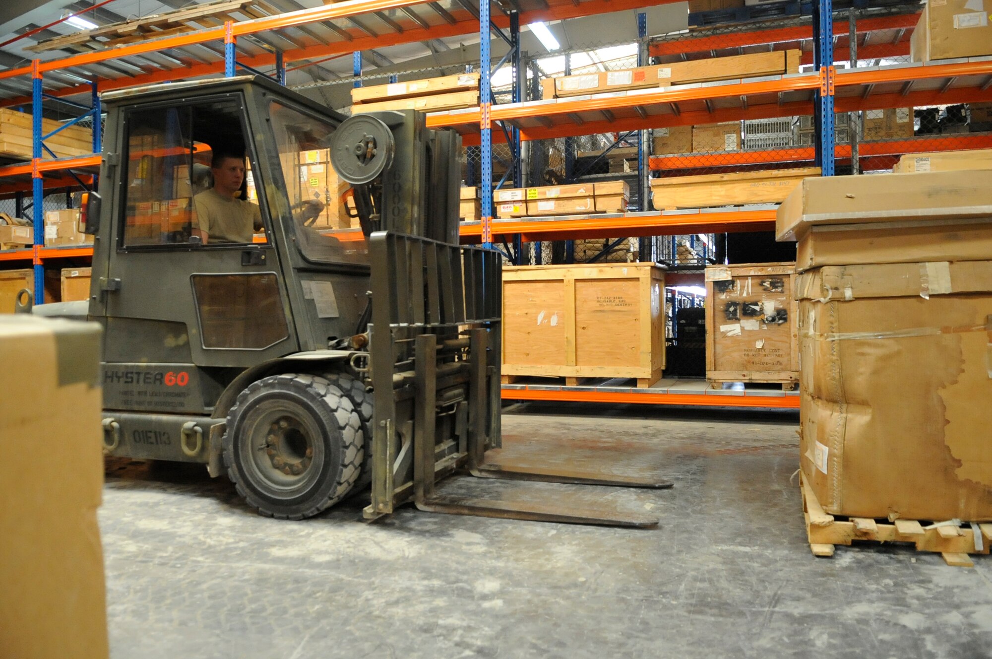 SOUTHWEST ASIA, Senior Airman Garrett Wikum, 380th Expeditionary Logistics Readiness Squadron, operates a forklift while moving pallets in a supply warehouse Aug. 25. Airman Wikum was selected as the 380th Air Expeditionary Wing’s Warrior of the Week. Airman Wikum is deployed from Aviano AB, Italy and hails from Rathdrum, Idaho. (U.S. Air Force photo/Senior Airman Stephen Linch) 