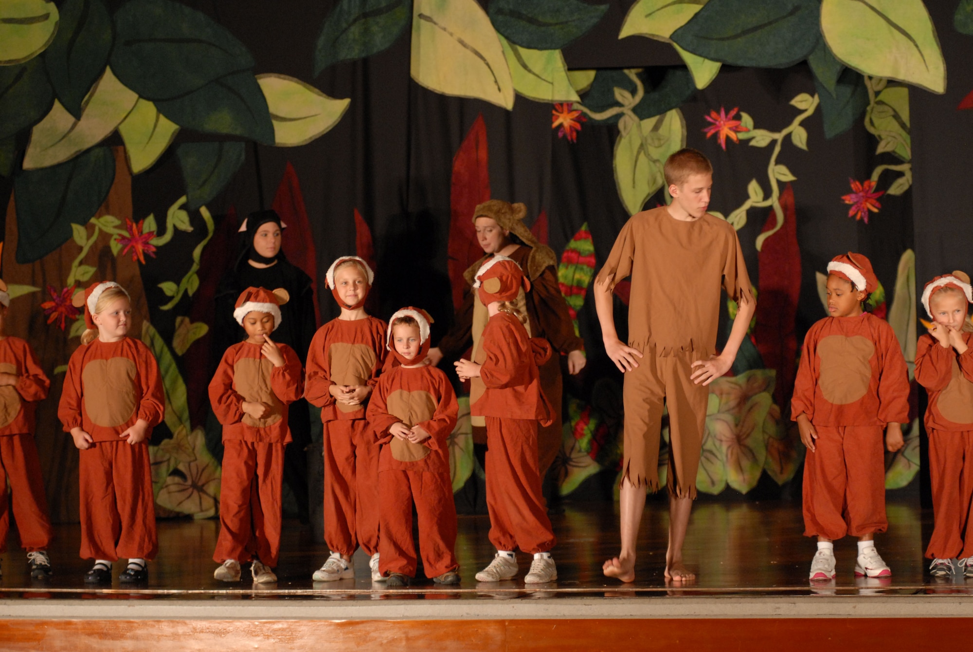 Brad Davies plays the role of Mowgli as he leads a group of younger children in the Missoula Children’s Theatre presentation of “The Jungle Book” Aug. 22.  The musical was made possible by the team from the MCT, whose trip was sponsored by Pacific Air Force, with the assistance of the Schilling Community Center and Kadena’s School Age Program.  (U.S. Air Force photo/Staff Sgt. Christopher Marasky)