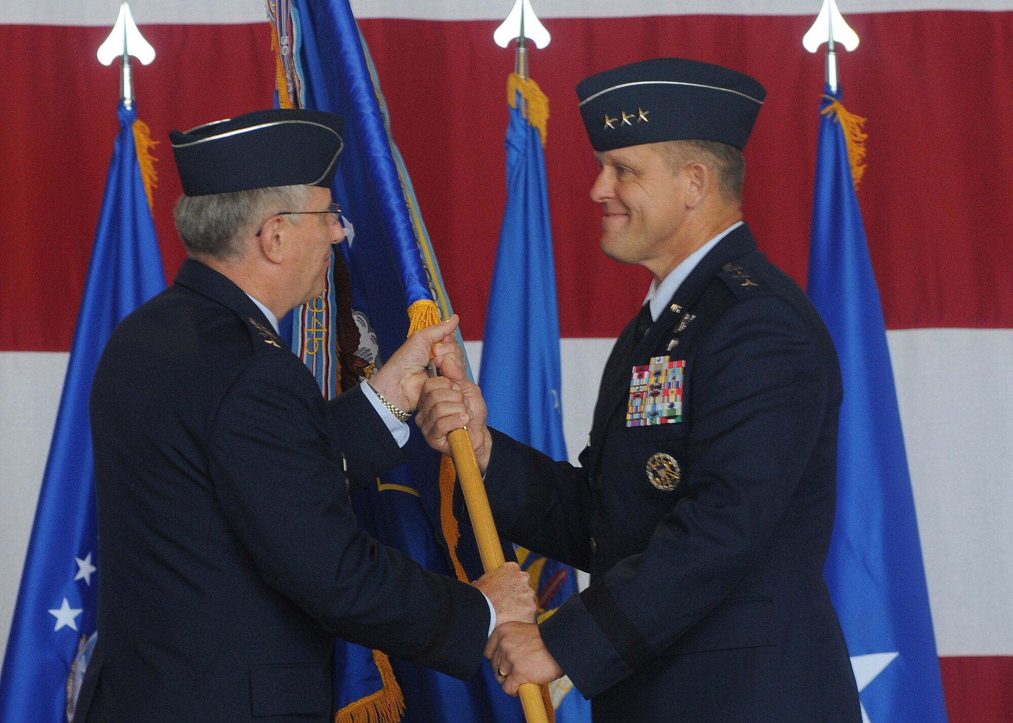 Gen. Roger Brady; U.S. Air Forces in Europe commander; passes the 3rd Air Force guidon to Lt. Gen. Frank Gorenc; 3rd AF commander; during General Gorenc’s assumption of command ceremony Aug. 24, 2009, Ramstein. (U.S. Air Force photo by Staff Sgt. Charity Barrett)