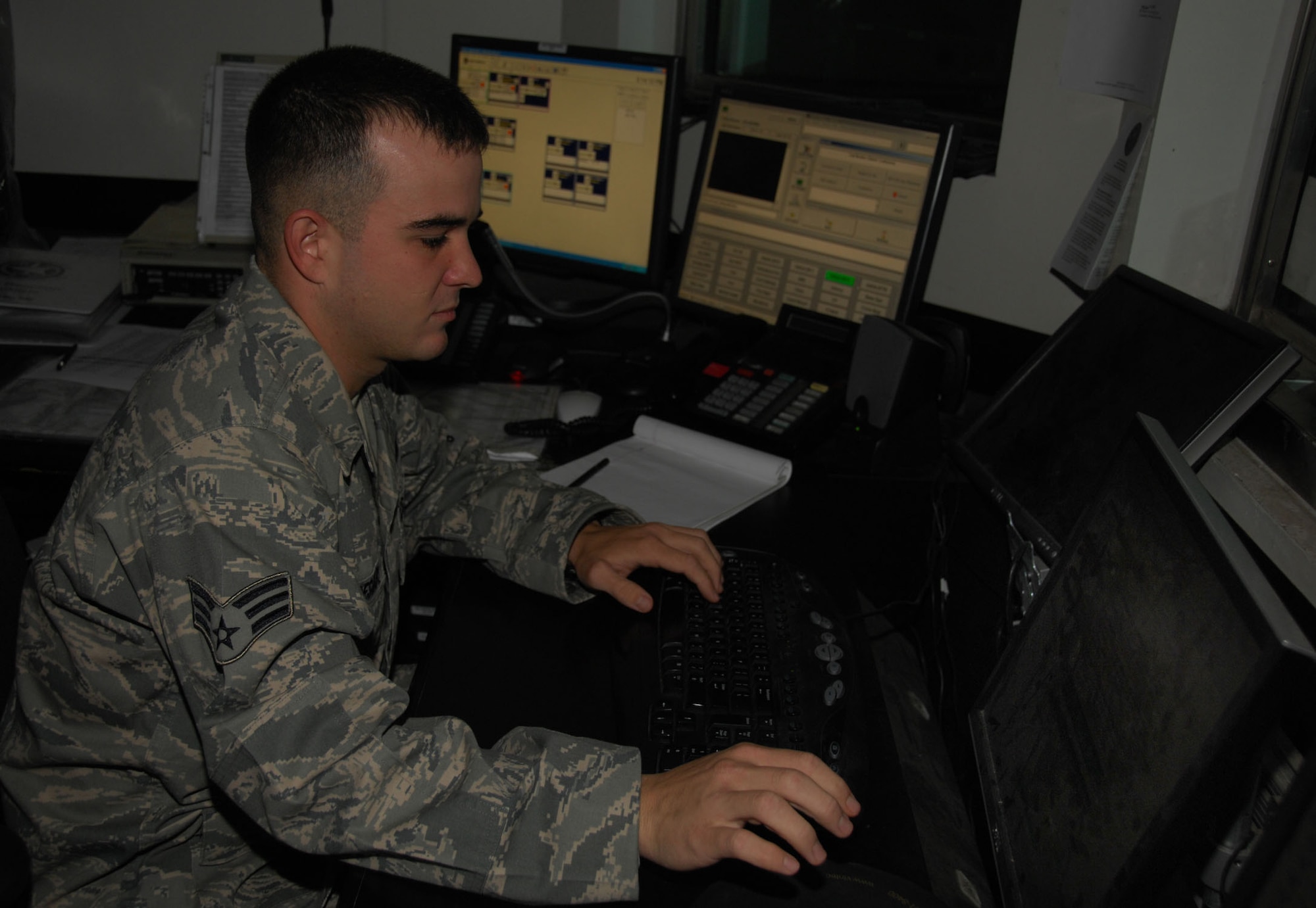 ANDERSEN AIR FORCE BASE, Guam - Senior Airman James Necessary, 36th Security Forces Squadron security controller, updates the police blotter here Aug. 24. Airman Necessary's day-to-day tasks include dispatching and controlling patrols during emergency and routine situations, monitoring and controlling all radio traffic and preparing the security forces blotter and daily correspondence. (U.S. Air Force photo by Senior Airman Shane Dunaway)