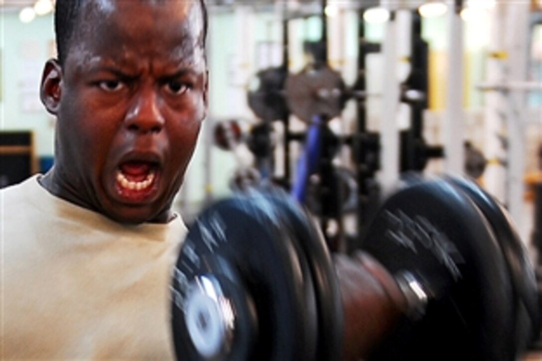 U.S. Army Spc. Nealy D. Edwards works out six times a week in Basra, Iraq, Aug. 20, 2009. 
Edwards, assigned to the 17th Fires Brigade, Headquarters Battery, weighs 170 pounds and wants to add 20 pounds of muscle before he leaves Basra.
