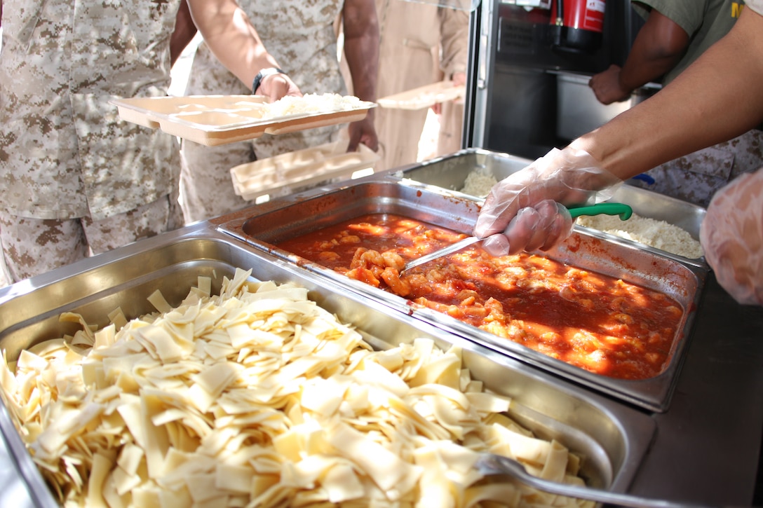 Marines of Marine Wing Support Squadron 374 set up a Field Food Service System near the Expeditionary Air Field at Camp Wilson Aug. 27. The FFSS was set up to feed hot food to Marines training in the field.