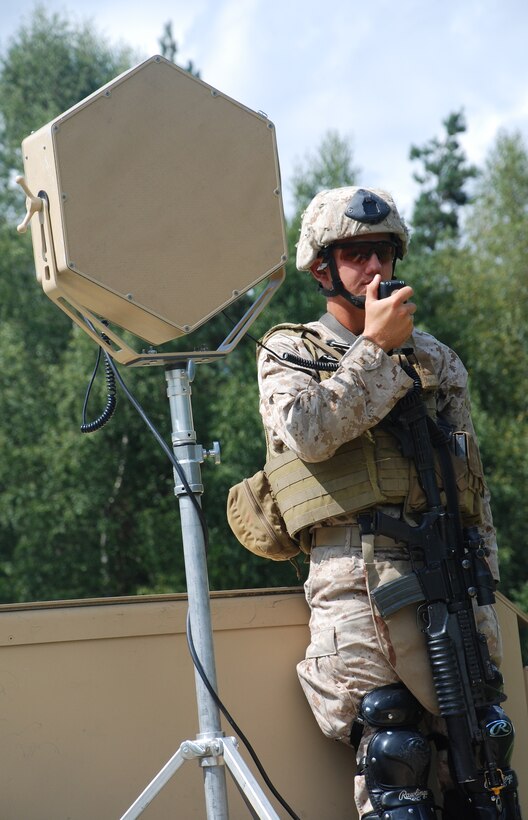 A Marine with 1st Fleet Anti-Terrorism Security Team (FAST) Company demonstrates the Long Range Acoustic Device (LRAD) during a non-lethal weapons capabilities exercise (CAPEX). The FAST Co. Marines conducted a week-long non-lethal weapons certification training exercises here in conjunction with the U.S. European and U.S. Africa Commands' NLW conference and CAPEX. The LRAD is hailing and warning device that can give clear verbal instructions audible at up to 300 meters, with some models (not pictured) able to exceed 500 meters.