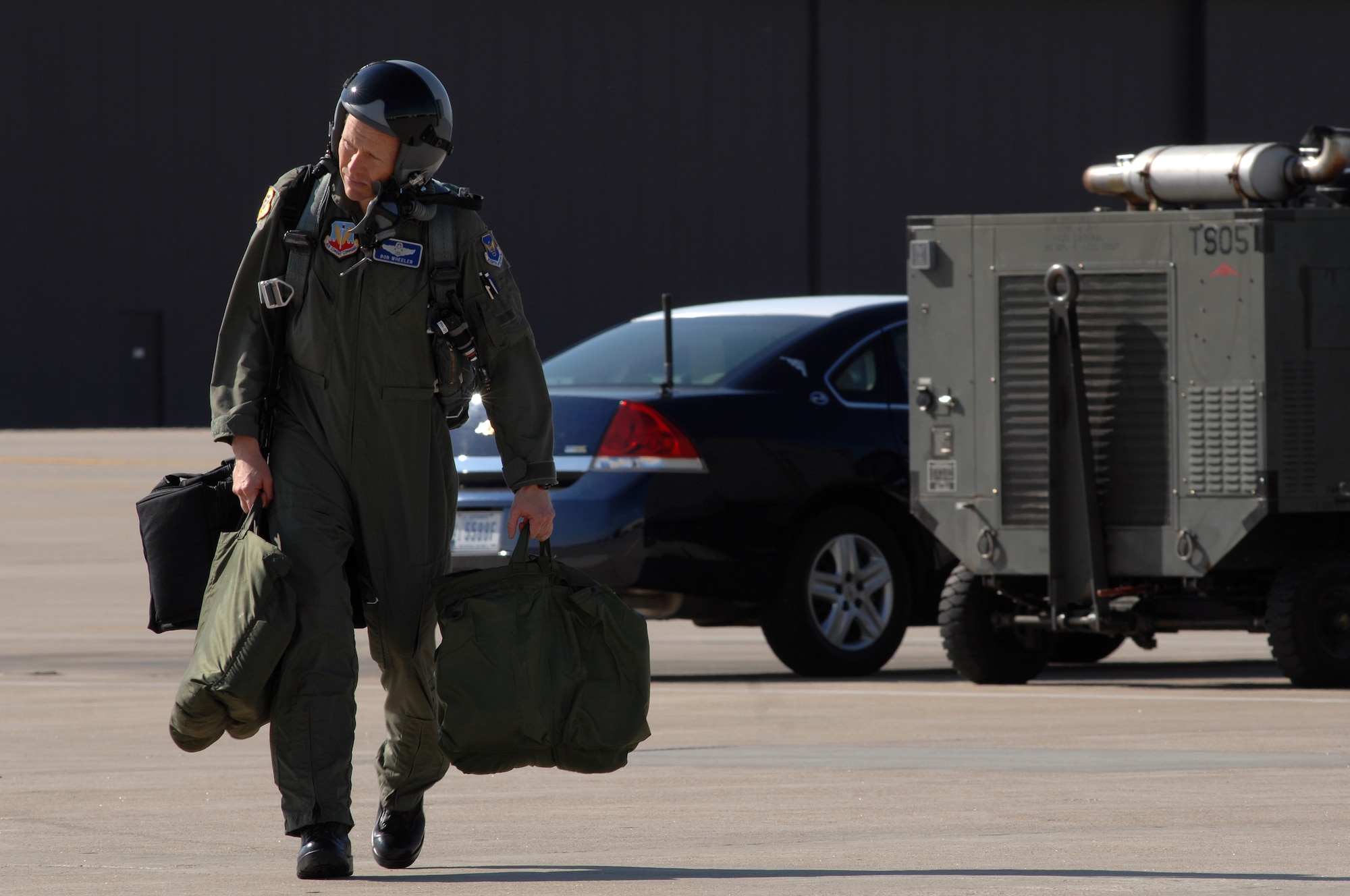 WHITEMAN AIR FORCE BASE, Mo. - Brig Gen. Robert Wheeler, 509th Bomb Wing commander, walks across the flightline to his aircraft in preparation for a B-2 Spirit mission Aug. 24. Twenty B-2 Spirit aircrafts are assigned to the 509th Bomb Wing. The B-2's primary mission is to attack time-critical targets early in a conflict to minimize an enemy's war-making potential. (U.S. Air Force photo/Senior Airman Kenny Holston)