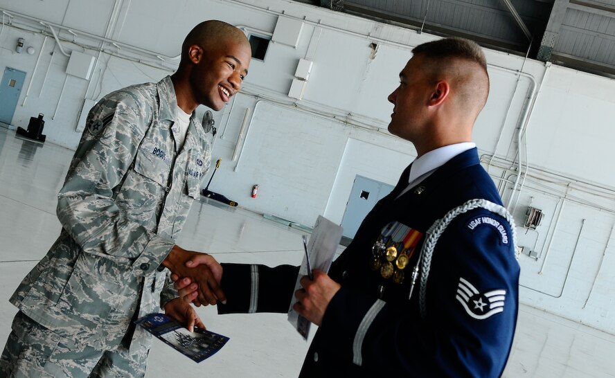 Staff Sgt. Alex Frizzo, United States Air Force Honor Guard training instructor, gets information from Airman 1st Class Ahmun Bogus, 6th Operational Support Squadron member and prospective Honor Guard recruit, Aug. 25 at MacDill Air Force Base, Fla. The Honor Guard is always looking for exceptional Airmen of all ranks to add to their numbers and help accomplish the mission. (U.S. Air Force photo by Senior Airman Alexandre Montes) 