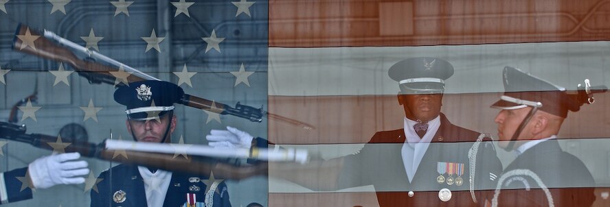 United States Air Force Honor Guard Drill Team members perform their four-man routine inside a hangar Aug. 25, at MacDill Air Force Base, Fla. The Drill Team is chosen from the most skilled members of the United States Air Force Honor Guard while the four-man team is chosen from the most skilled of the drill team. The four-man routine performance features a professionally choreographed sequence of show-stopping weapon maneuvers, precise tosses and complex weapon exchanges. This was a short stop for the team with only two more stops in Florida before heading to the West Coast where they will continue to showcase military precision and teamwork with their complex drill routine. (U.S. Air Force photo by Senior Airman Alexandre Montes) 