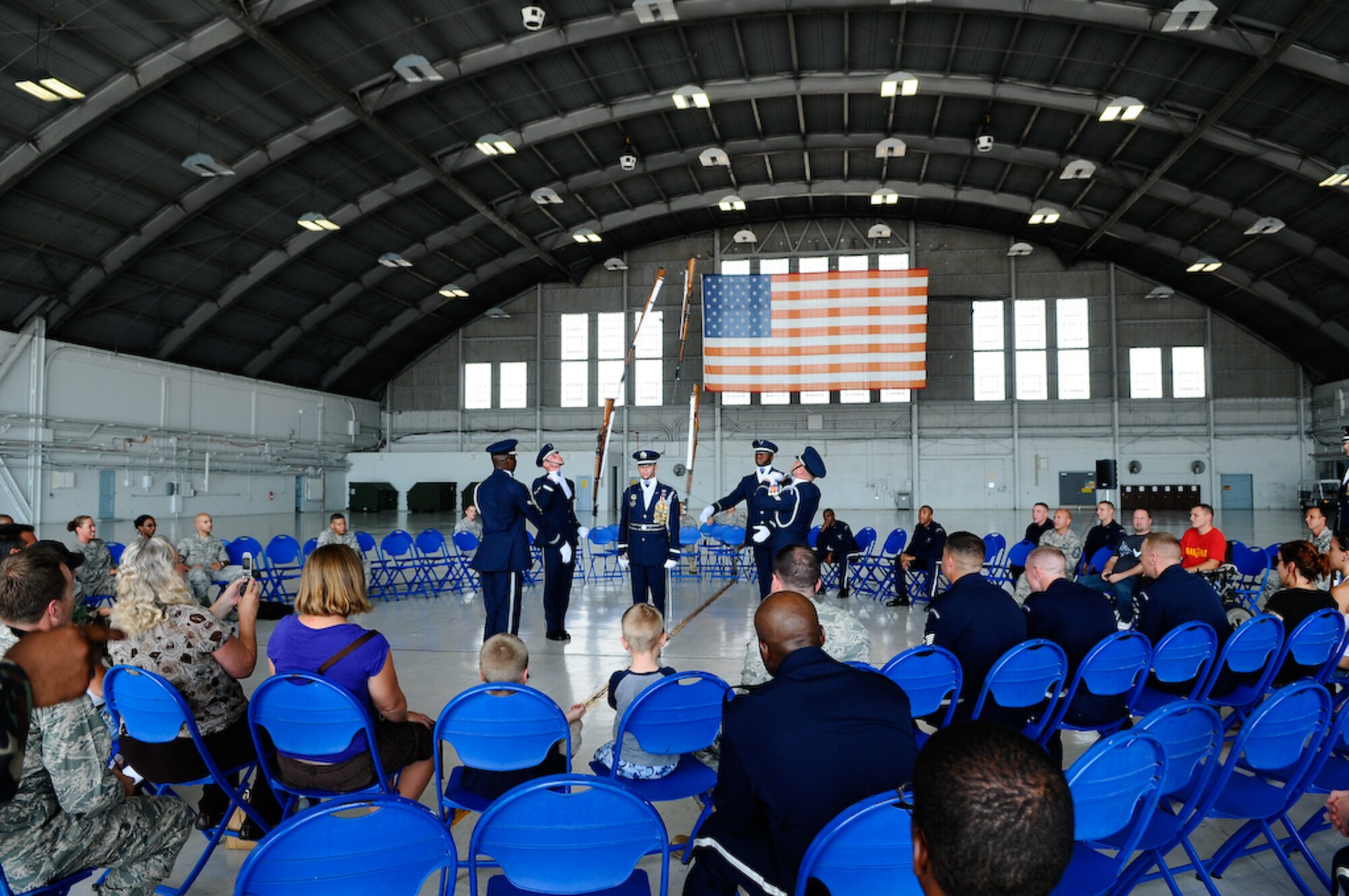 The United States Air Force Honor Guard Drill Team performs inside a hangar Aug. 25, at MacDill Air Force Base, Fla. This was a short stop for the team with only two more stops in Florida before heading to the West Coast where they will continue to showcase military precision and teamwork with their complex drill routine. (U.S. Air Force photo by Senior Airman Alexandre Montes) 