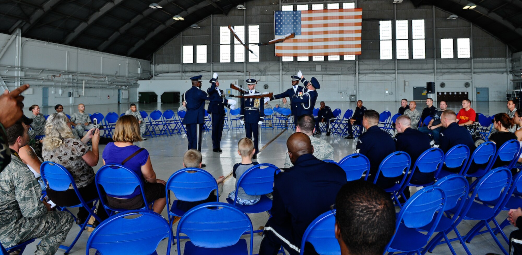 The United States Air Force Honor Guard Drill Team performs inside a hangar Aug. 25, at MacDill Air Force Base, Fla. This was a short stop for the team with only two more stops in Florida before heading to the West Coast where they will continue to showcase military precision and teamwork with their complex drill routine. (U.S. Air Force photo by Senior Airman Alexandre Montes) 
