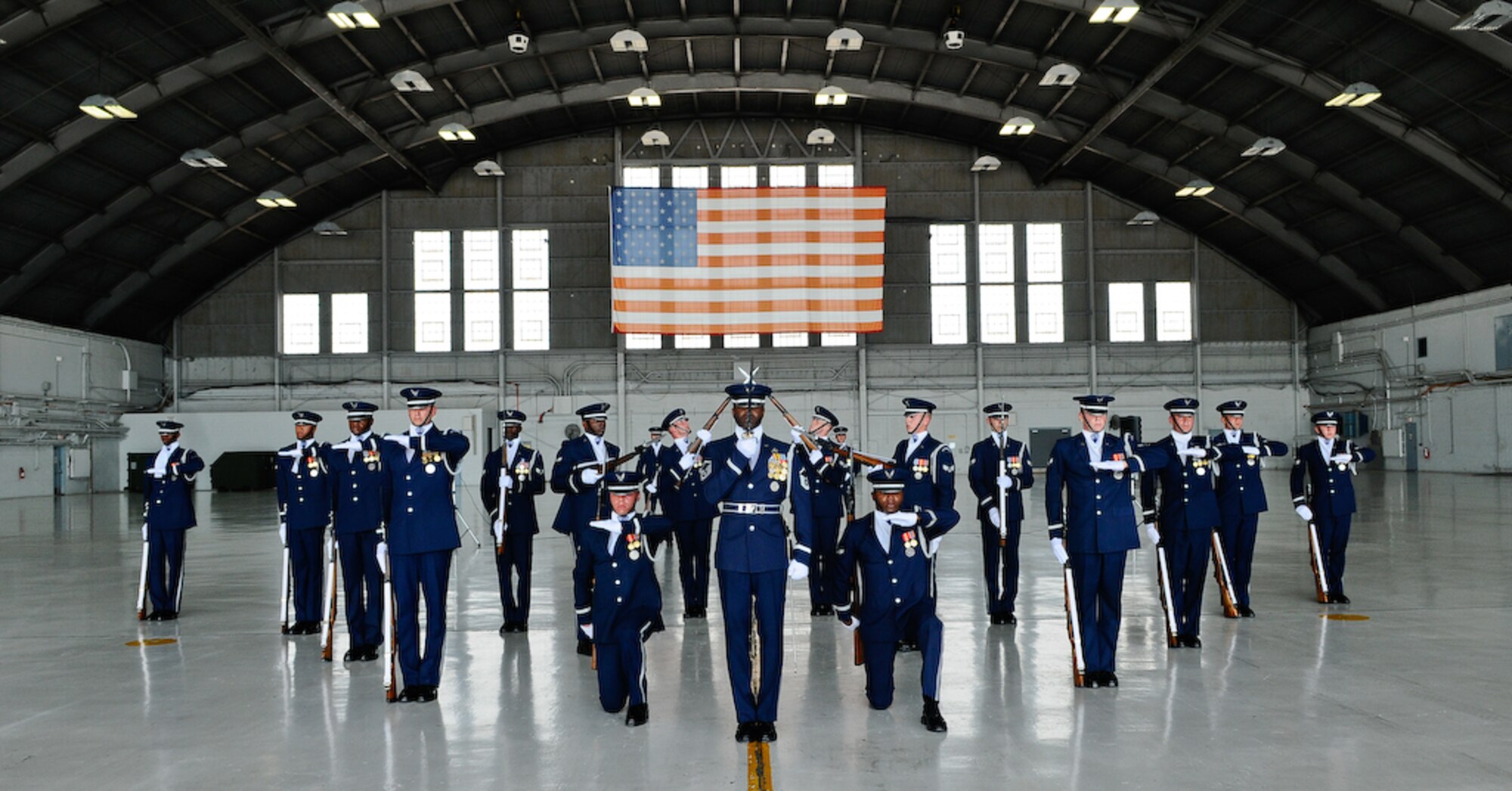 The United States Air Force Honor Guard Drill Team performs inside a hangar Aug. 25, at MacDill Air Force Base, Fla. This was a short stop for the team with only two more stops in Florida before heading to the West Coast where they will continue to showcase military precision and teamwork with their complex drill routine. (U.S. Air Force photo by Senior Airman Alexandre Montes) 