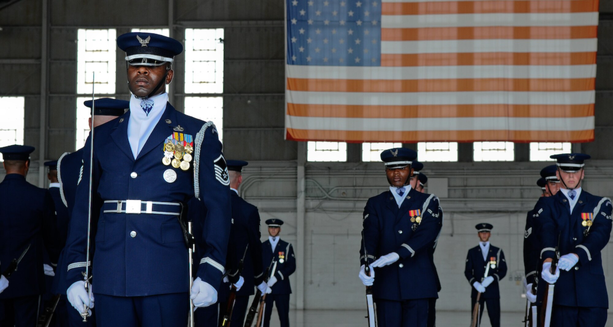 The United States Air Force Honor Guard Drill Team performs inside a hangar Aug. 25, at MacDill Air Force Base, Fla. This was a short stop for the team with only two more stops in Florida before heading to the West Coast where they will continue to showcase military precision and teamwork with their complex drill routine. (U.S. Air Force photo by Senior Airman Alexandre Montes) 