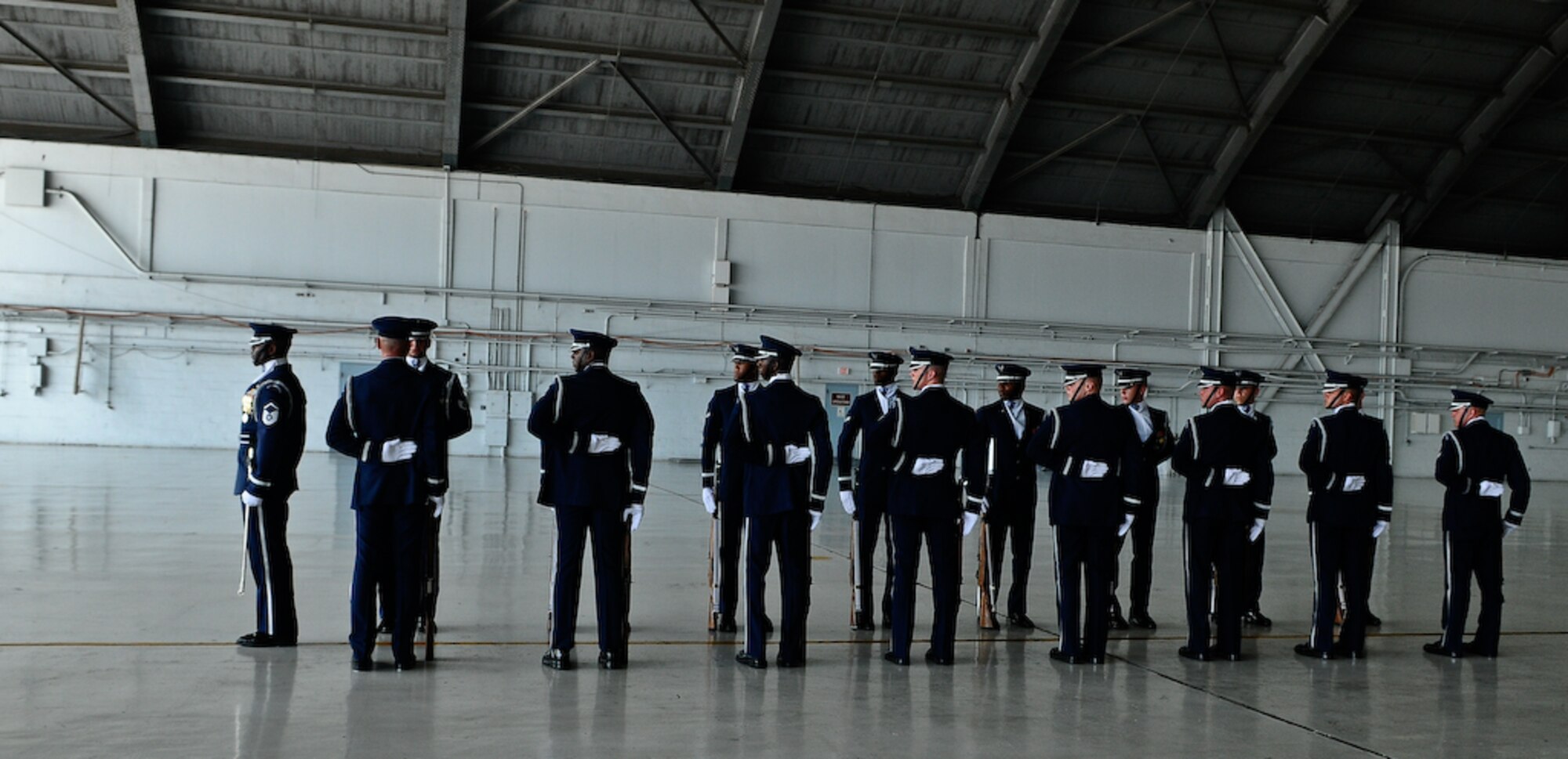 The United States Air Force Honor Guard Drill Team performs inside a hangar Aug. 25, at MacDill Air Force Base, Fla. This was a short stop for the team with only two more stops in Florida before heading to the West Coast where they will continue to showcase military precision and teamwork with their complex drill routine. (U.S. Air Force photo by Senior Airman Alexandre Montes) 
