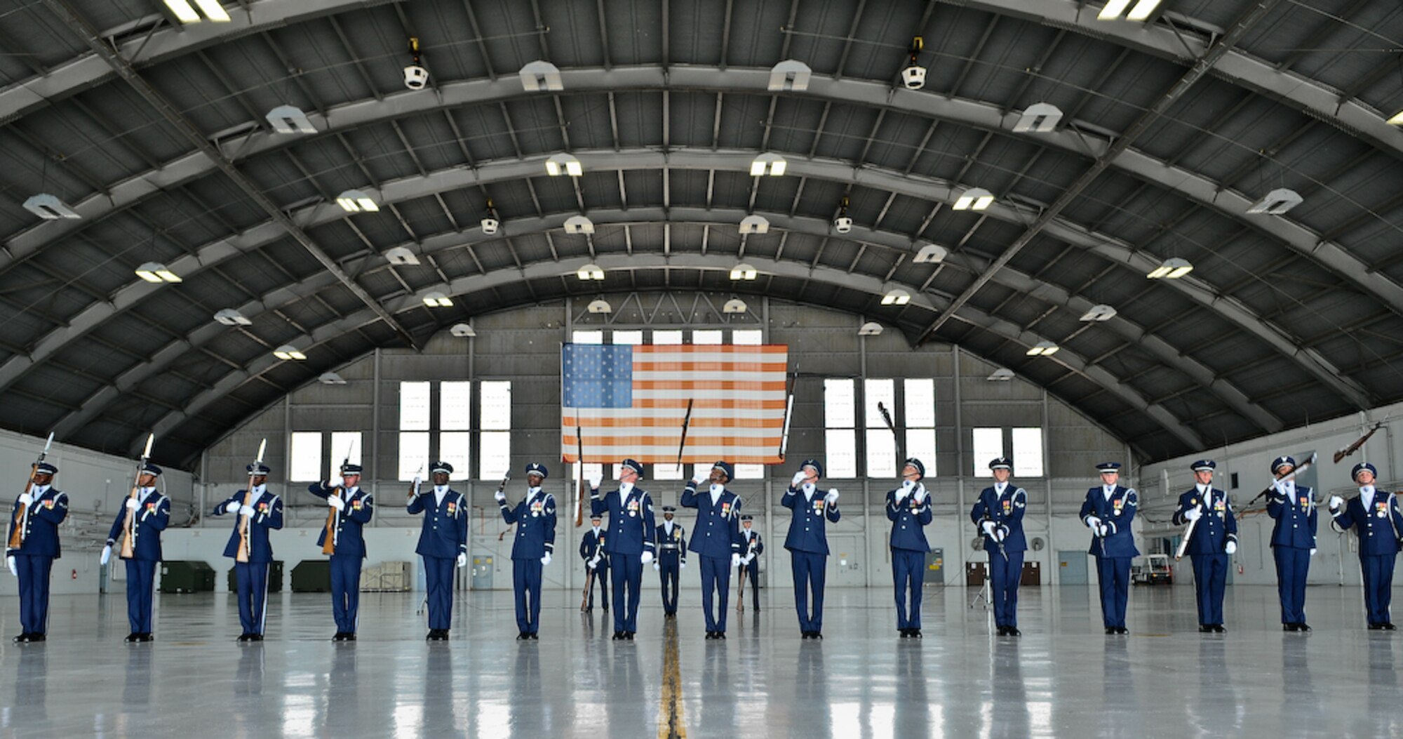 The United States Air Force Honor Guard Drill Team performs inside a hangar Aug. 25, at MacDill Air Force Base, Fla. This was a short stop for the team with only two more stops in Florida before heading to the West Coast where they will continue to showcase military precision and teamwork with their complex drill routine. (U.S. Air Force photo by Senior Airman Alexandre Montes) 