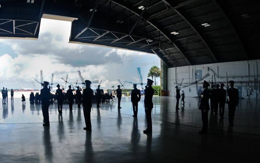 The United States Air Force Honor Guard Drill Team performs inside a hangar Aug. 25, at MacDill Air Force Base, Fla. This was a short stop for the team with only two more stops in Florida before heading to the West Coast where they will continue to showcase military precision and teamwork with their complex drill routine. (U.S. Air Force photo by Senior Airman Alexandre Montes) 