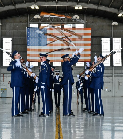 The United States Air Force Honor Guard Drill Team performs inside a hangar Aug. 25, at MacDill Air Force Base, Fla. This was a short stop for the team with only two more stops in Florida before heading to the West Coast where they will continue to showcase military precision and teamwork with their complex drill routine. (U.S. Air Force photo by Senior Airman Alexandre Montes) 